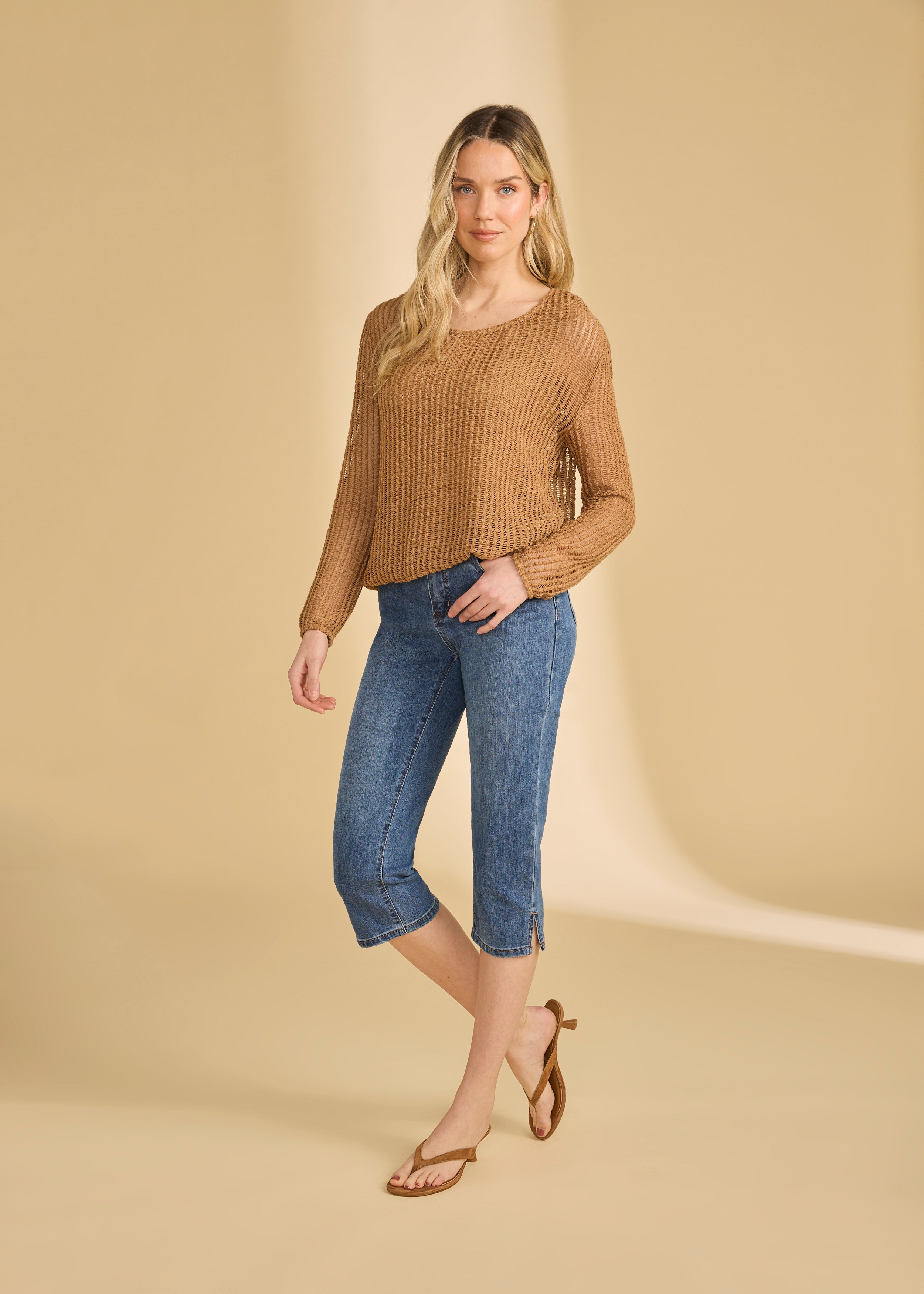 Full body view of darker indigo blue cropped jeans styled with long-sleeve top by French Dressing Jeans (FDJ)