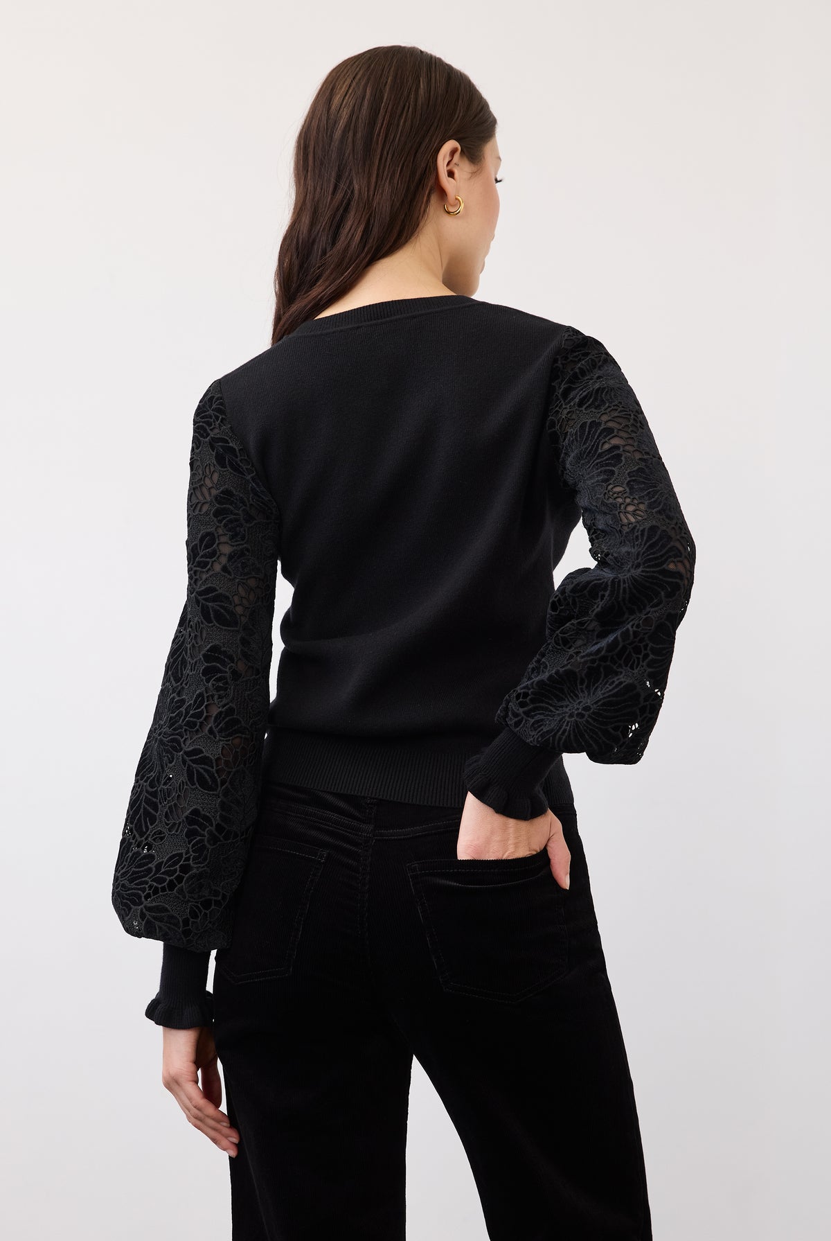 Back view of black sweater with velvet detailing on sleeves by French Dressing Jeans (FDJ)
