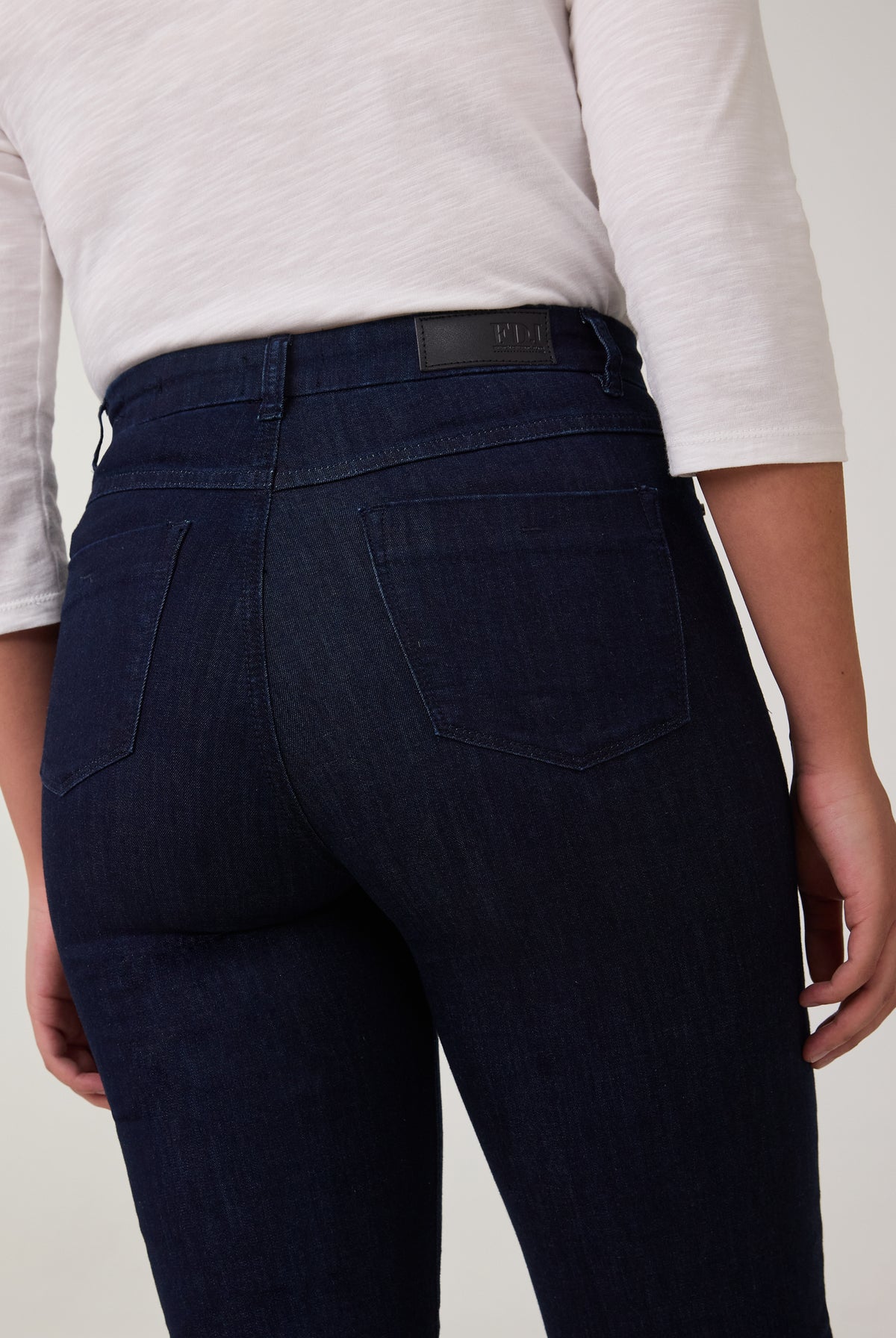 Close-up of back pocket detail on dark Delight jeans by French Dressing Jeans (FDJ)