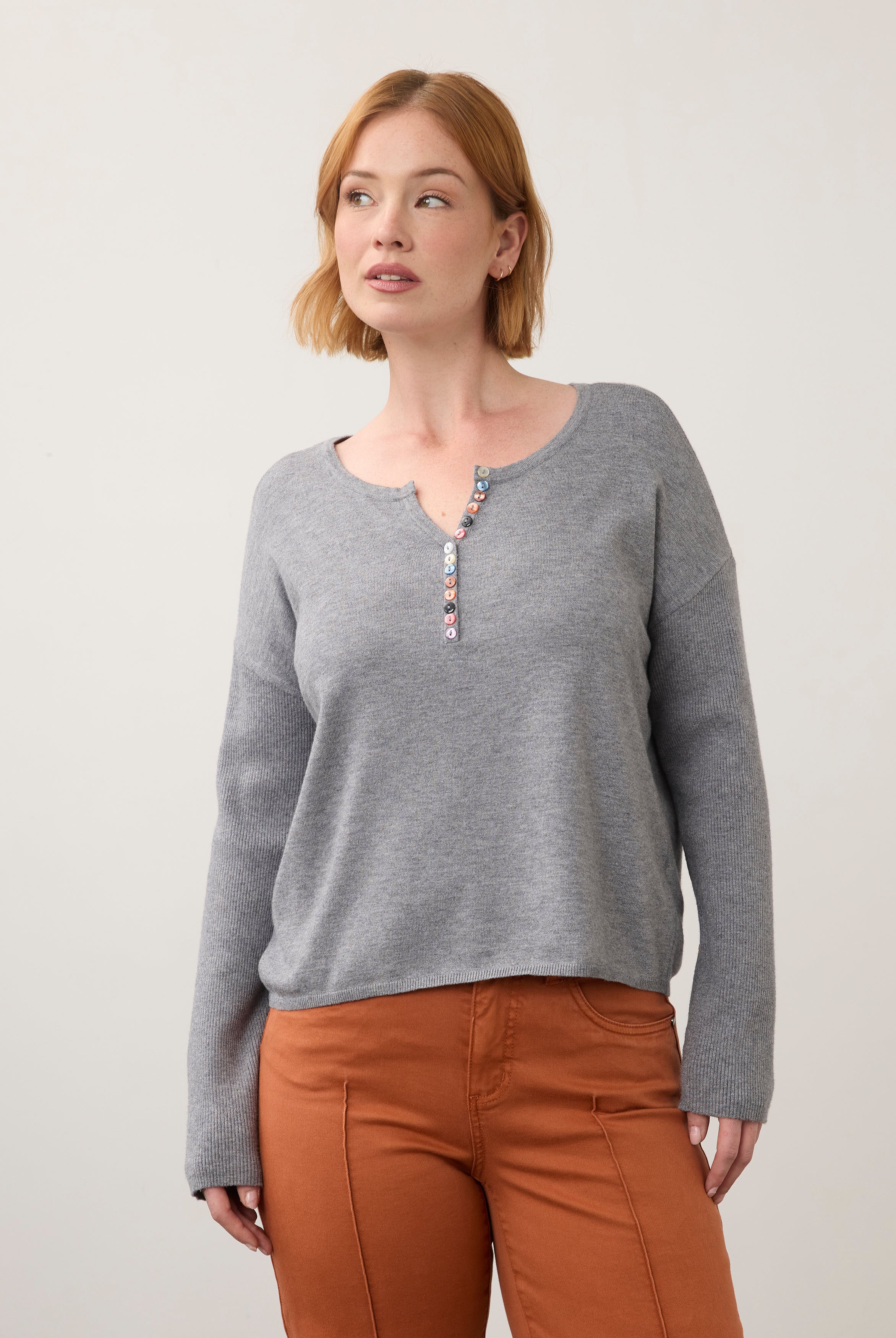 Front view of grey sweater featuring colorful buttons by French Dressing Jeans (FDJ)