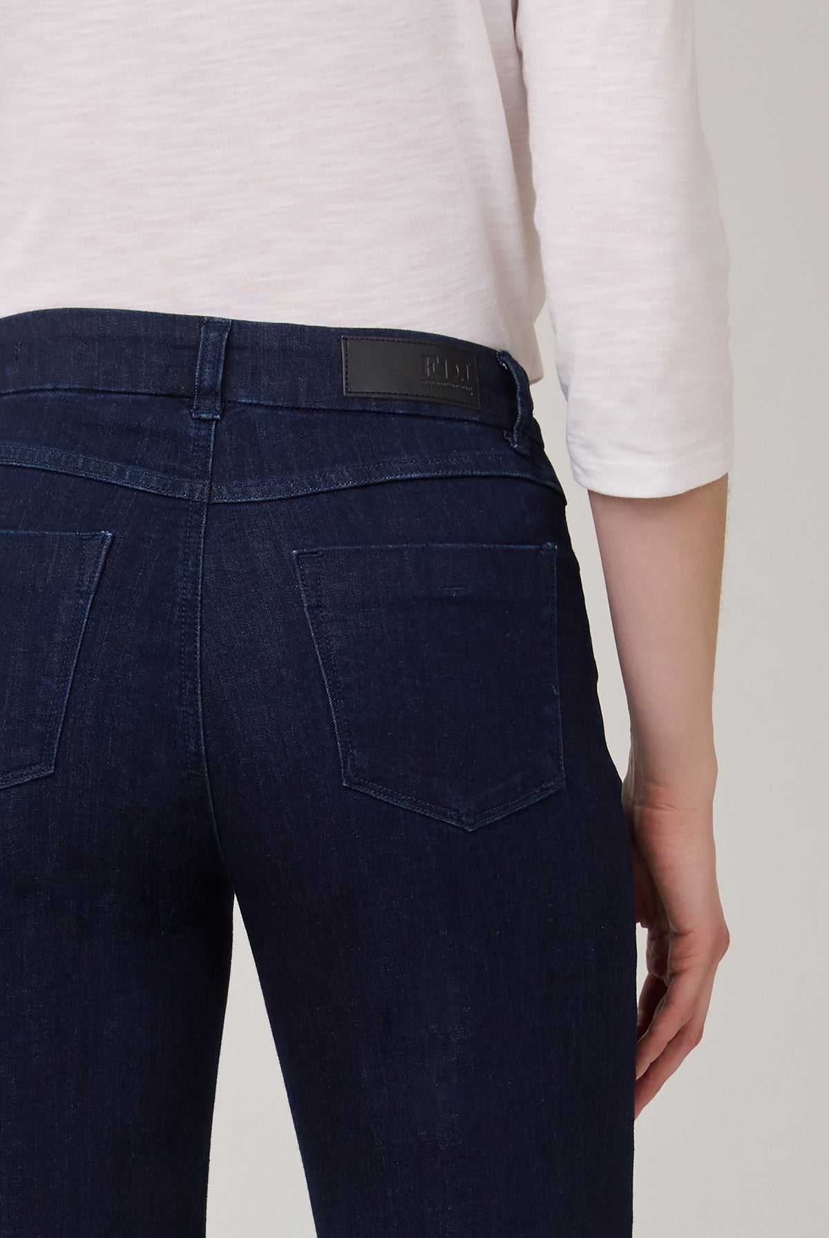 Detail shot of back pockets on dark Delight wide-leg jeans by French Dressing Jeans (FDJ)