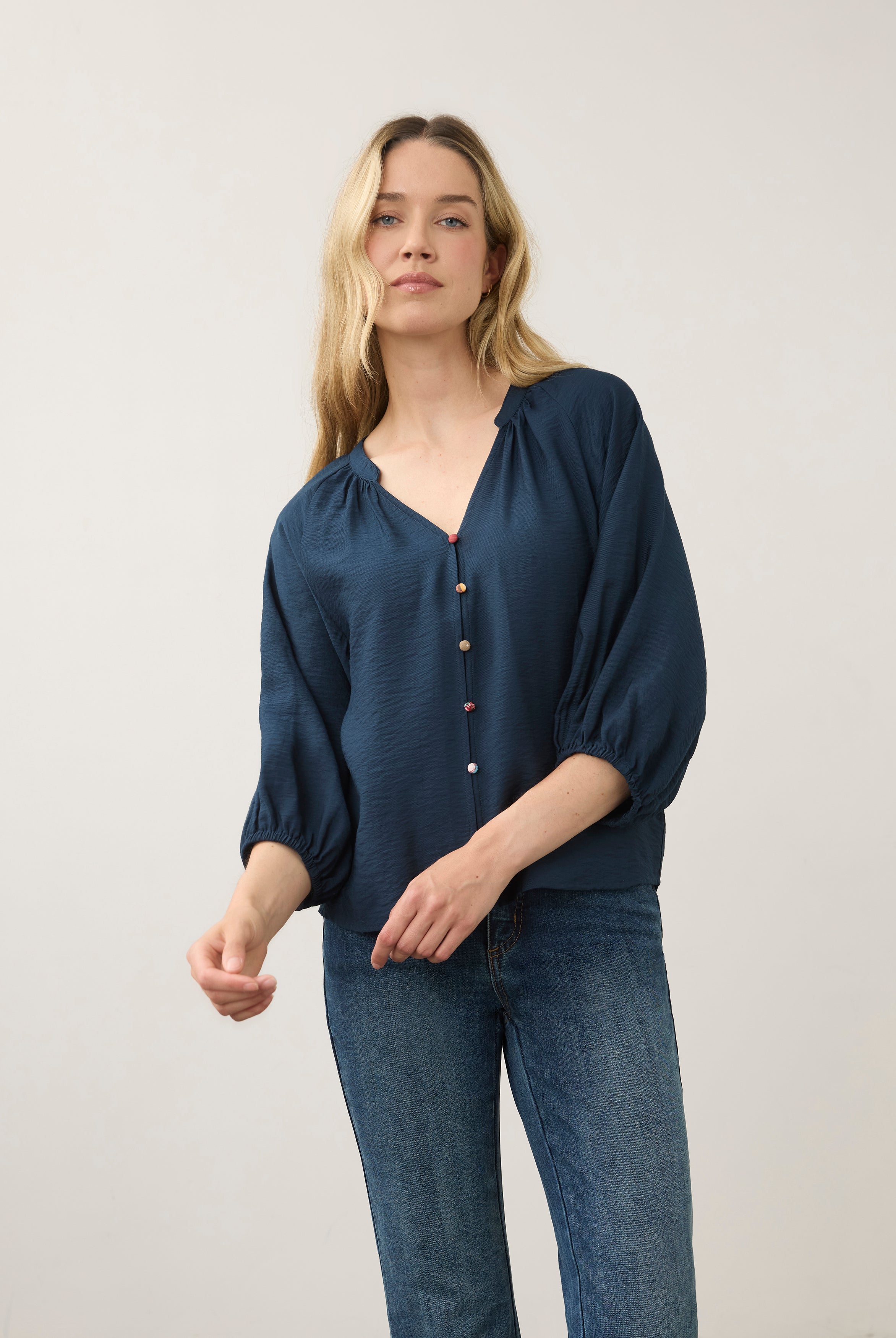 Front view of navy blouse with colorful buttons and V-neck by French Dressing Jeans (FDJ)