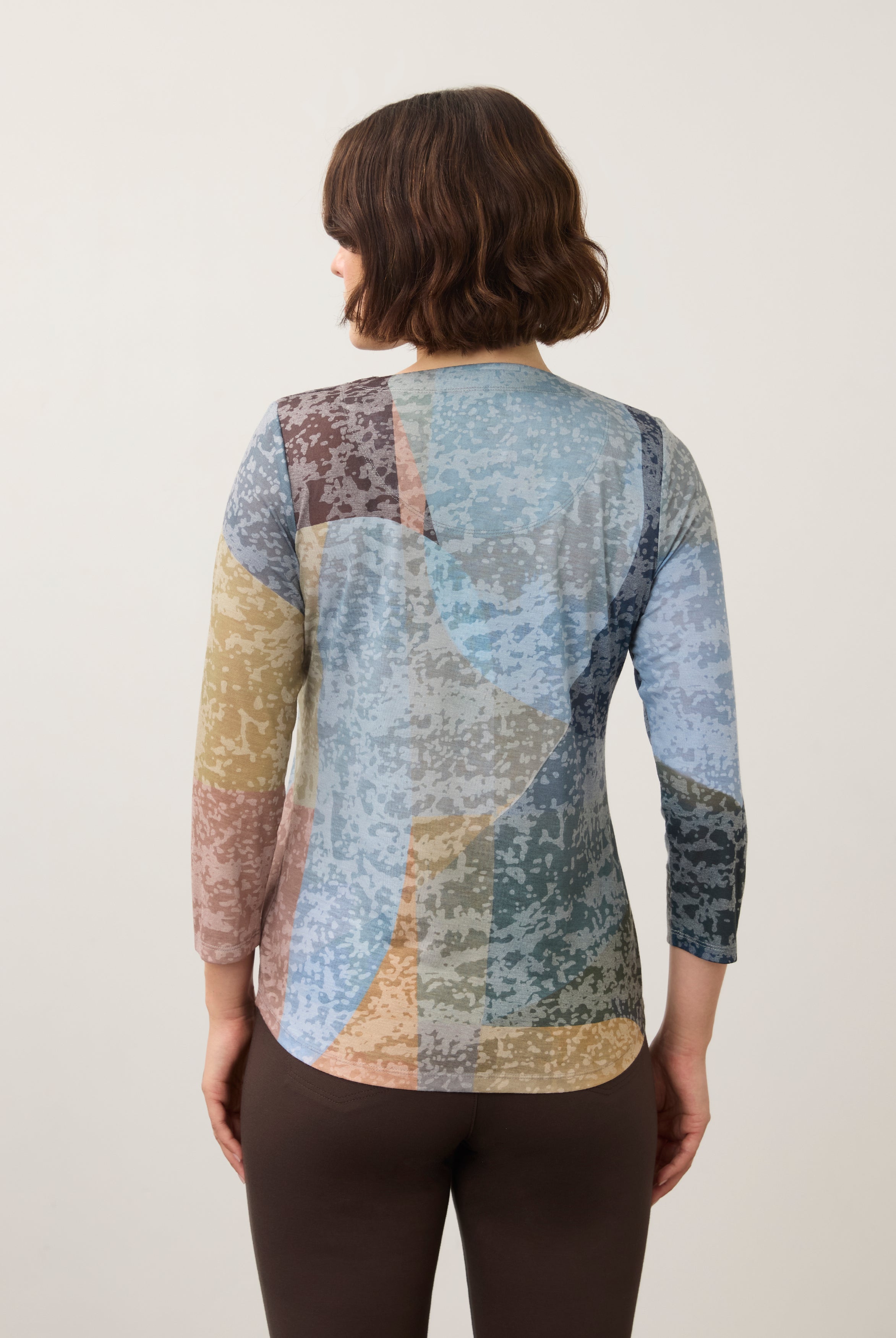 Back view of 3/4 sleeve top showing abstract pattern and rounded hem in Warn color by French Dressing Jeans (FDJ)