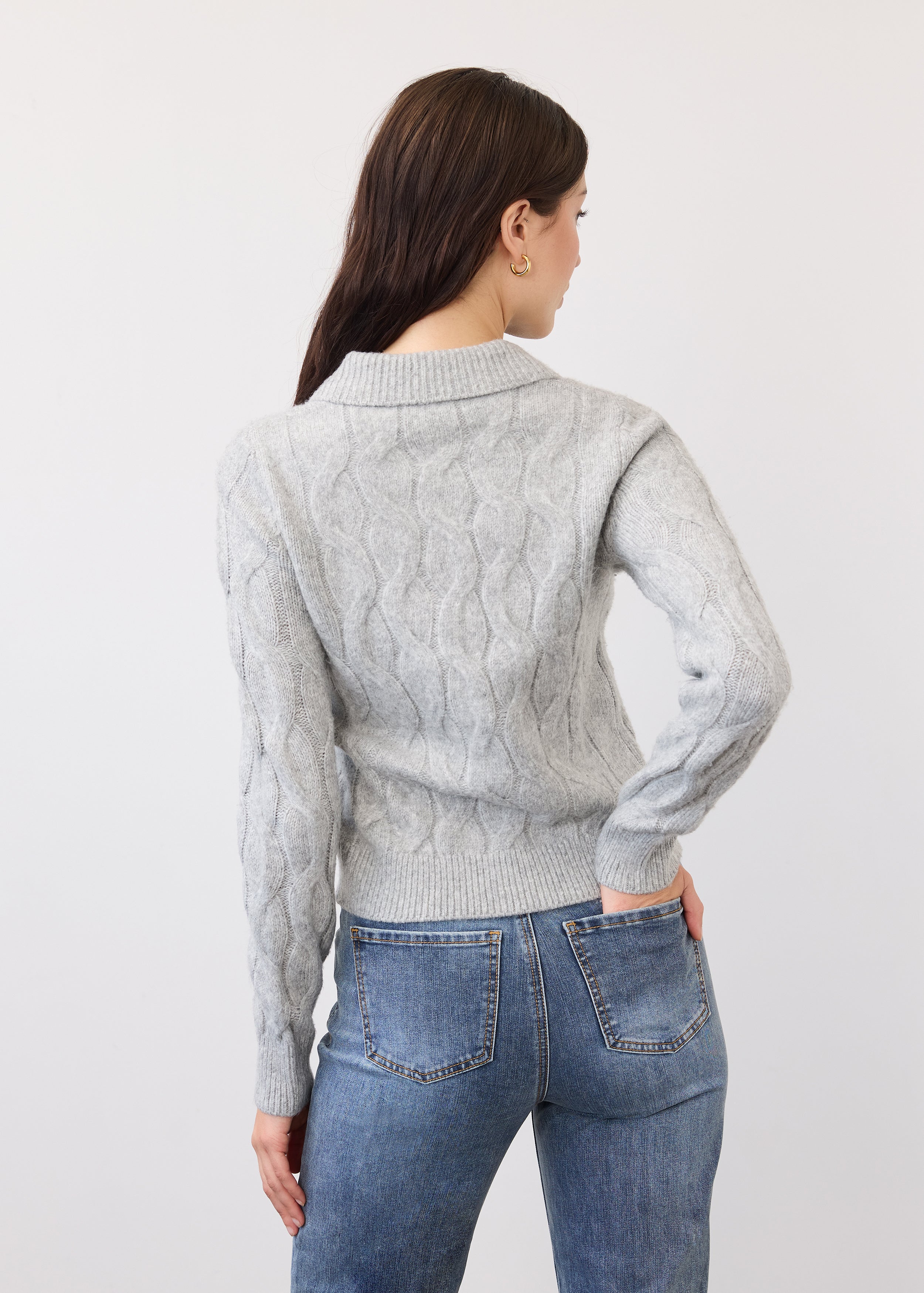 Back view of gray cabled cardigan showing textured knit pattern and ribbed hem by French Dressing Jeans (FDJ)