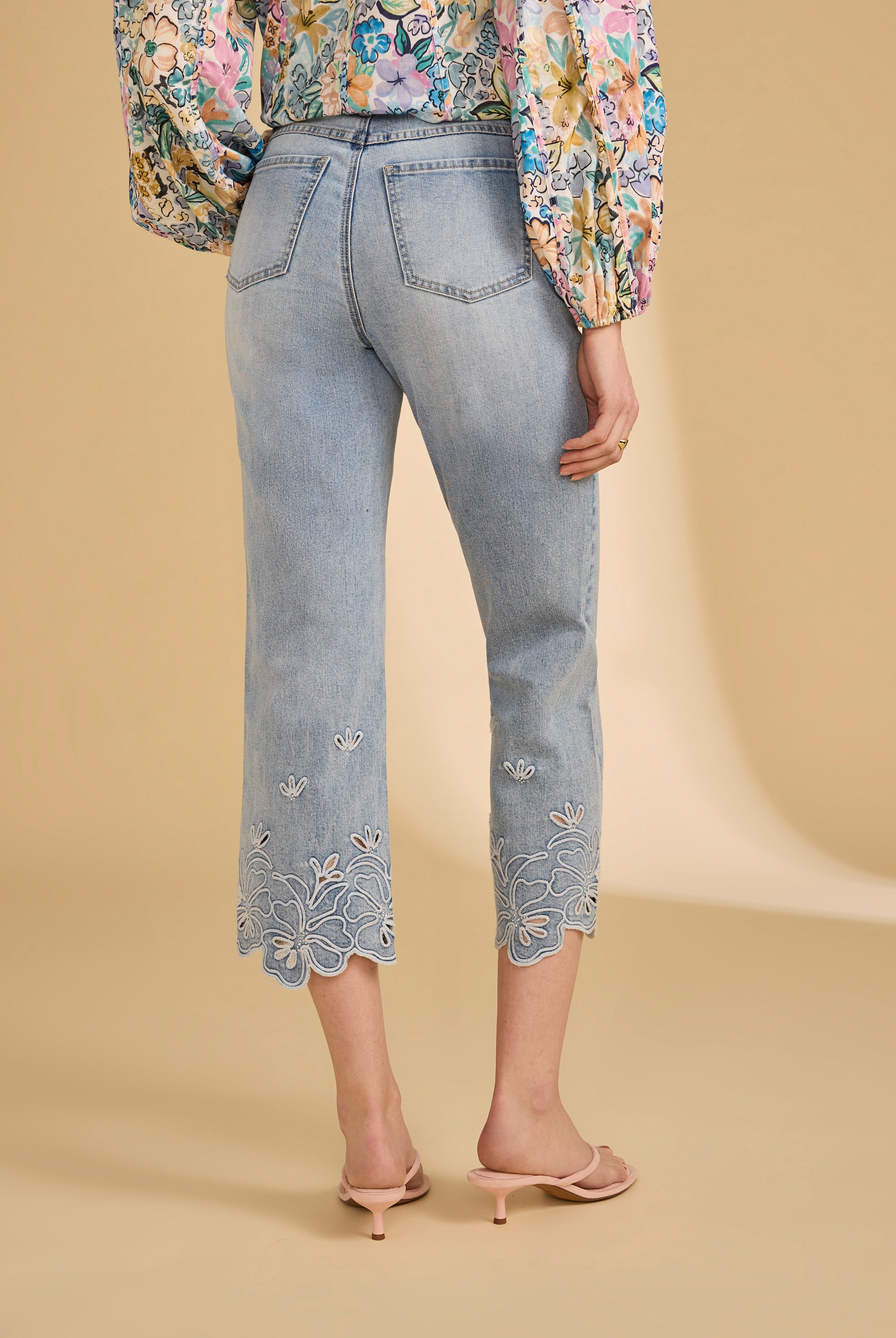 Back view of ocean denim jeans featuring floral embroidered hems by French Dressing Jeans (FDJ)