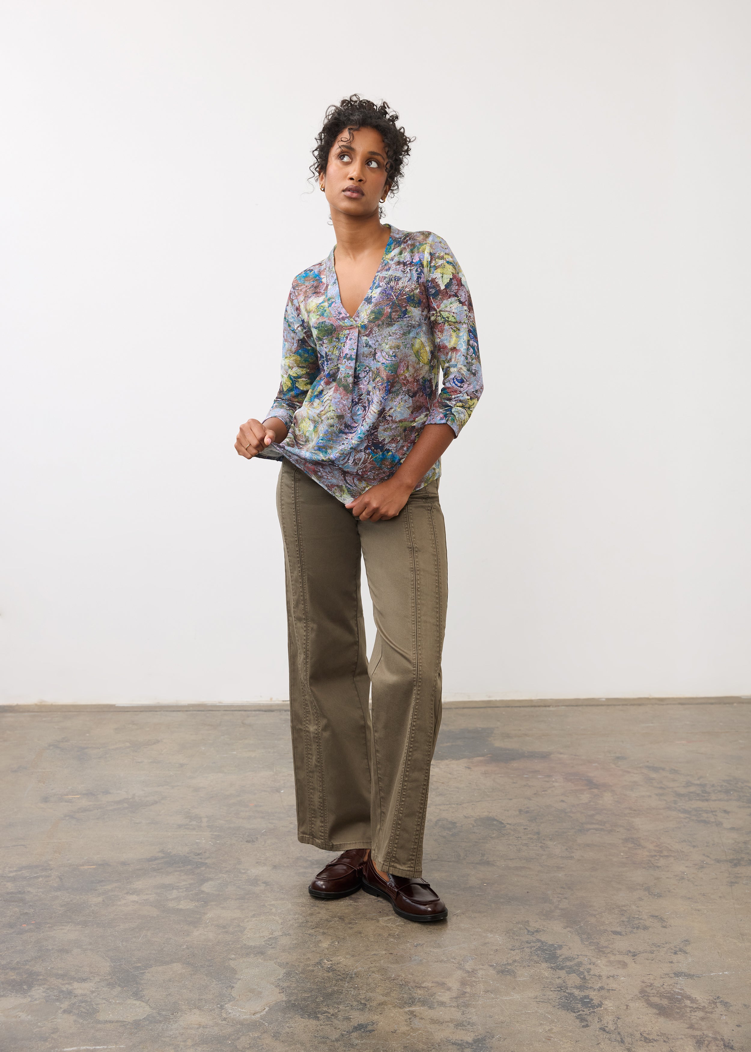 Full body view of 3/4 sleeve V-neck top paired with khaki pants, showcasing floral print by French Dressing Jeans (FDJ)