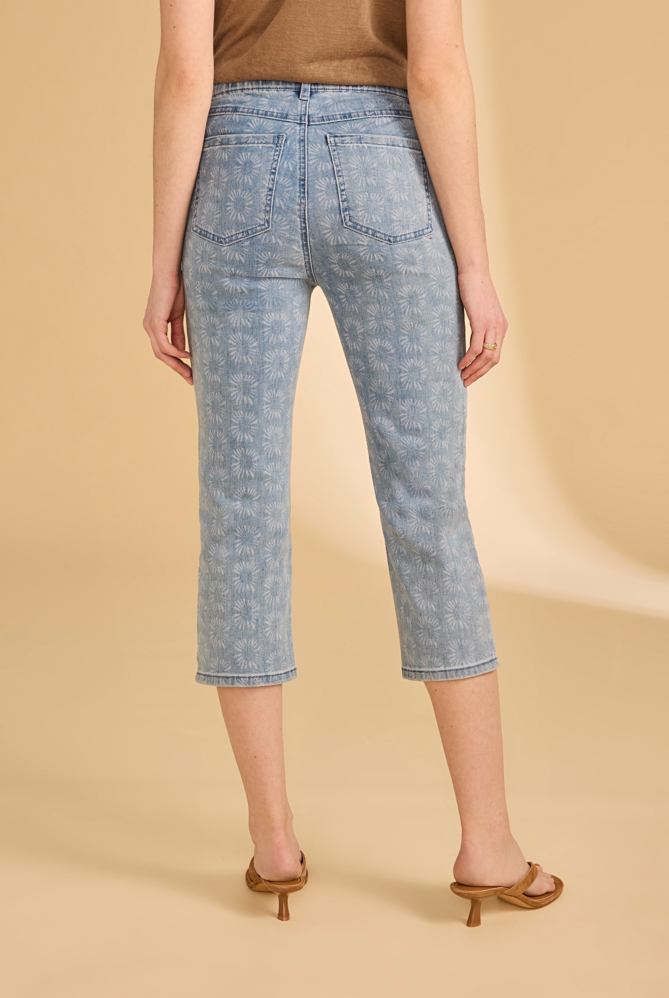 Back view of light medium capri denim featuring a floral print design by French Dressing Jeans (FDJ)
