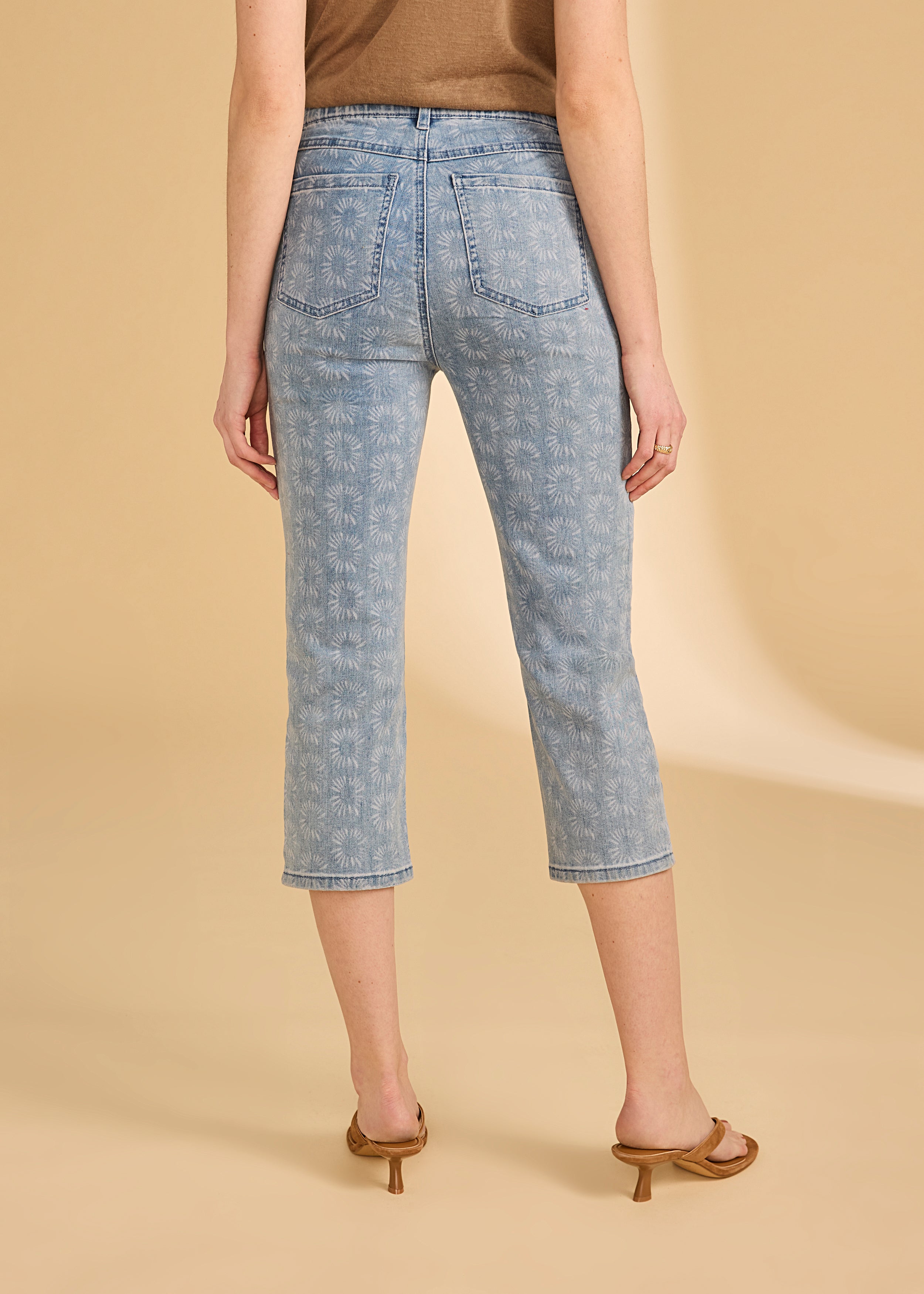 Back view of light medium capri denim featuring a floral print design by French Dressing Jeans (FDJ)