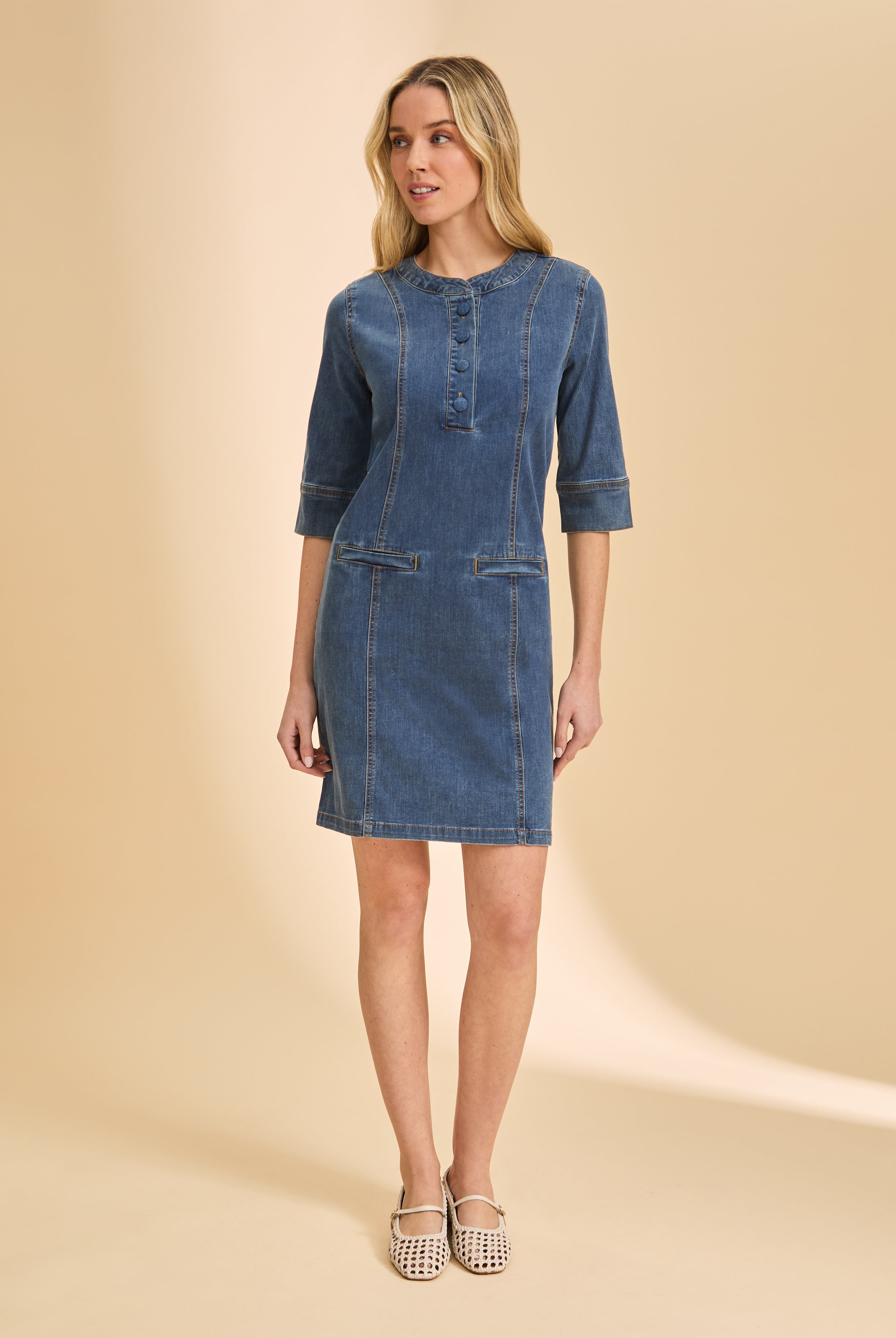 Full front view of denim dress highlighting seam details and round neckline by French Dressing Jeans (FDJ)