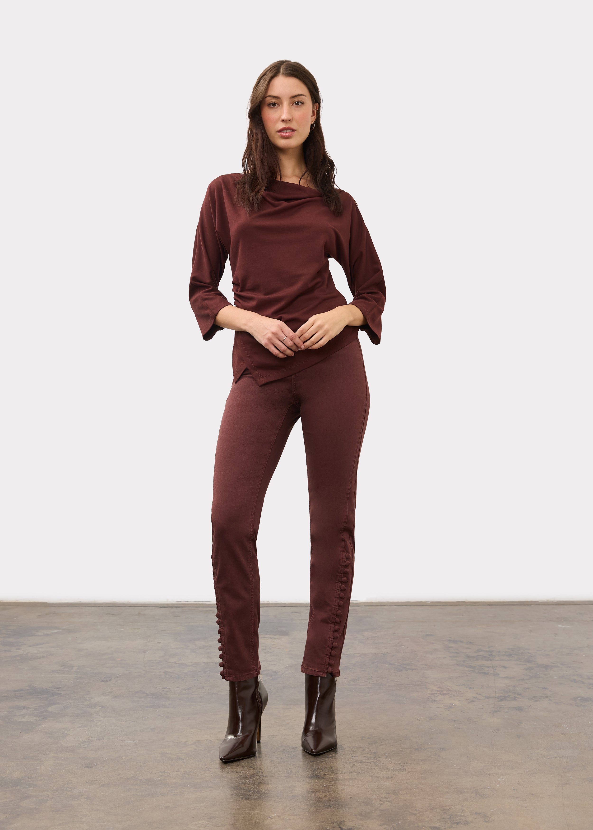 Full view of burgundy top paired with matching pants and brown boots by French Dressing Jeans (FDJ)