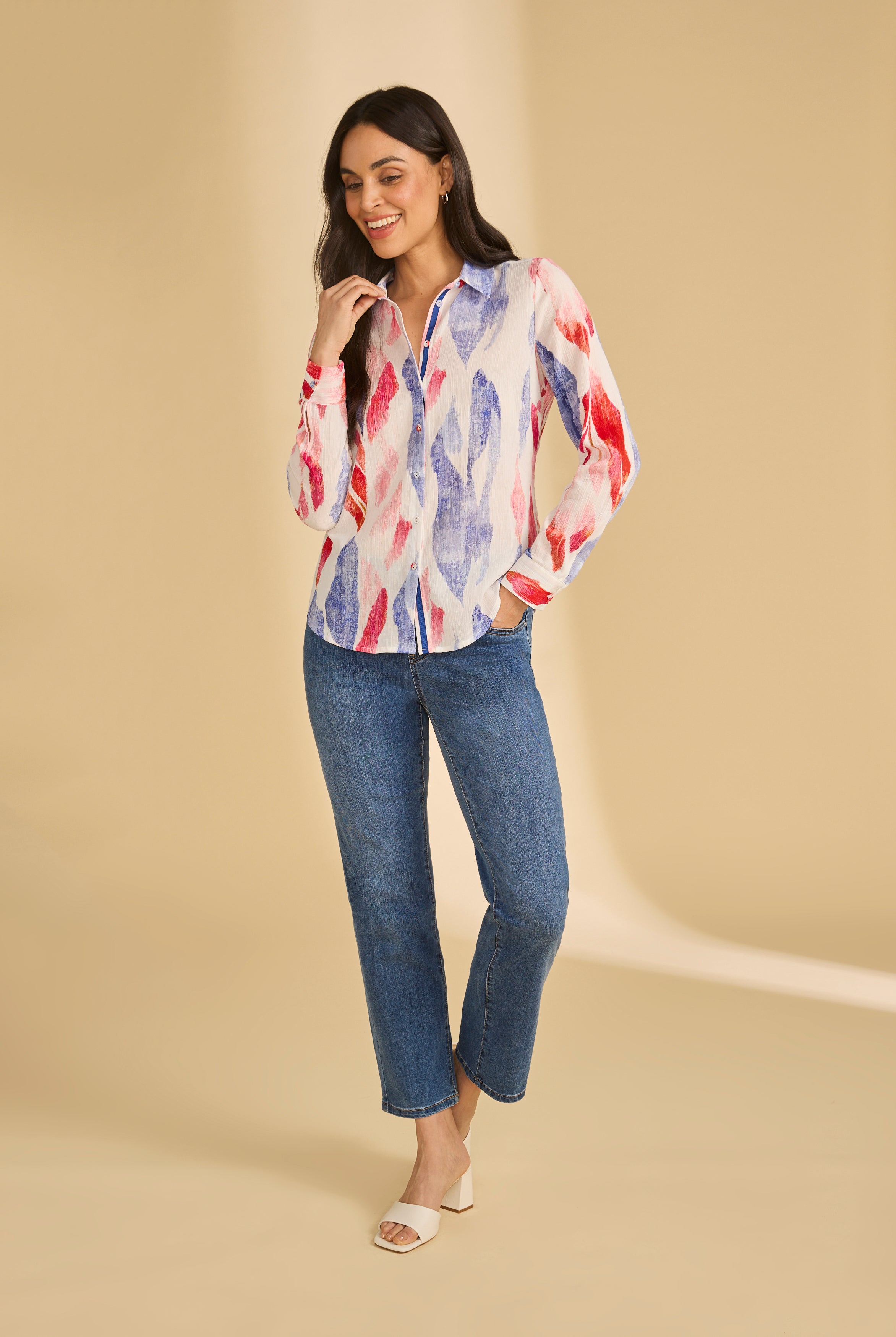 Full view of colorful long sleeve blouse paired with jeans, highlighting vibrant pattern, by French Dressing Jeans (FDJ)