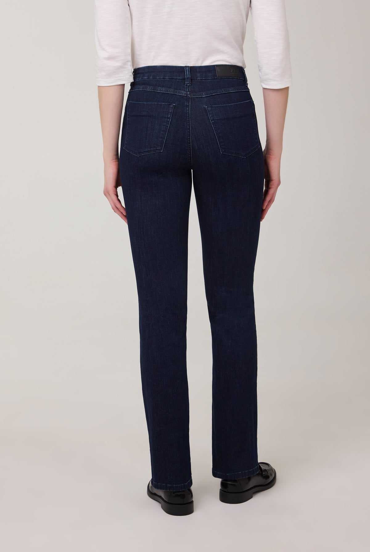 Back view of flared leg jeans in Delight color with patch pockets by French Dressing Jeans (FDJ)
