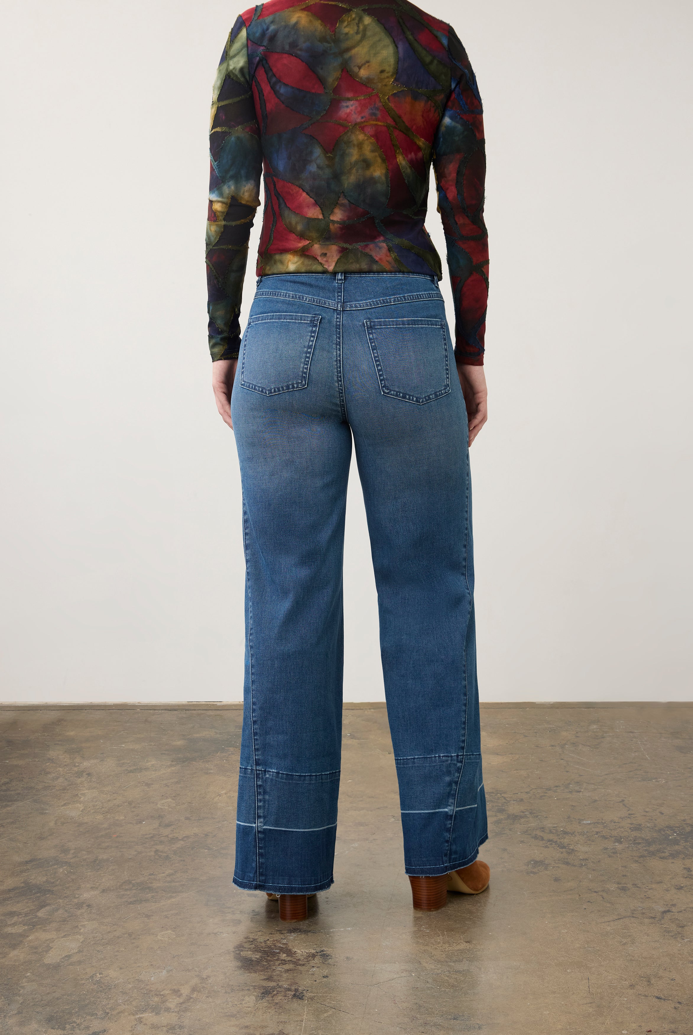 Back view of wide-leg dark wash jeans with artistic top, featuring patch pockets by French Dressing Jeans (FDJ) par French Dressing Jeans (FDJ)