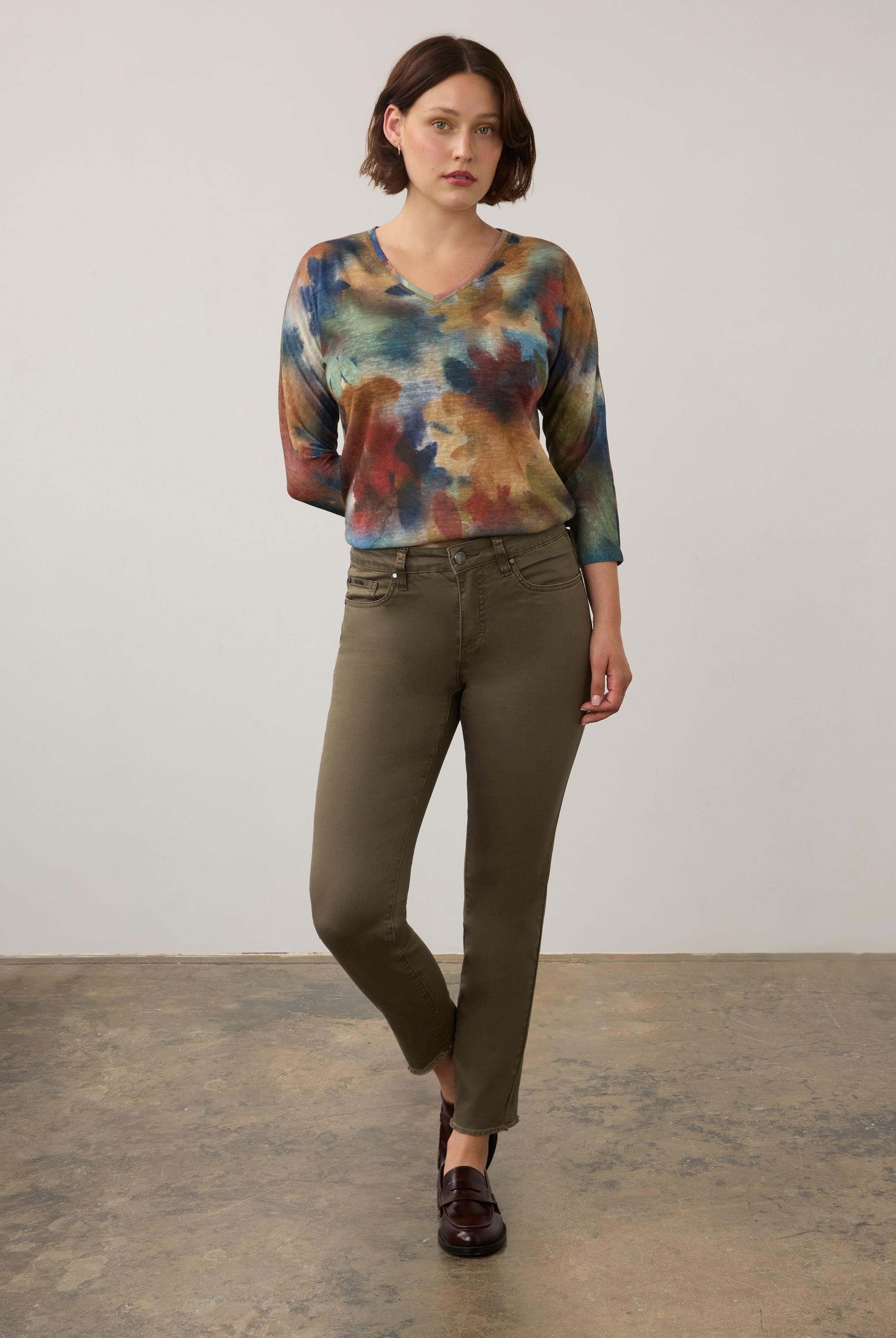 Full body view of watercolor Henley top with olive pants and loafers by French Dressing Jeans (FDJ)