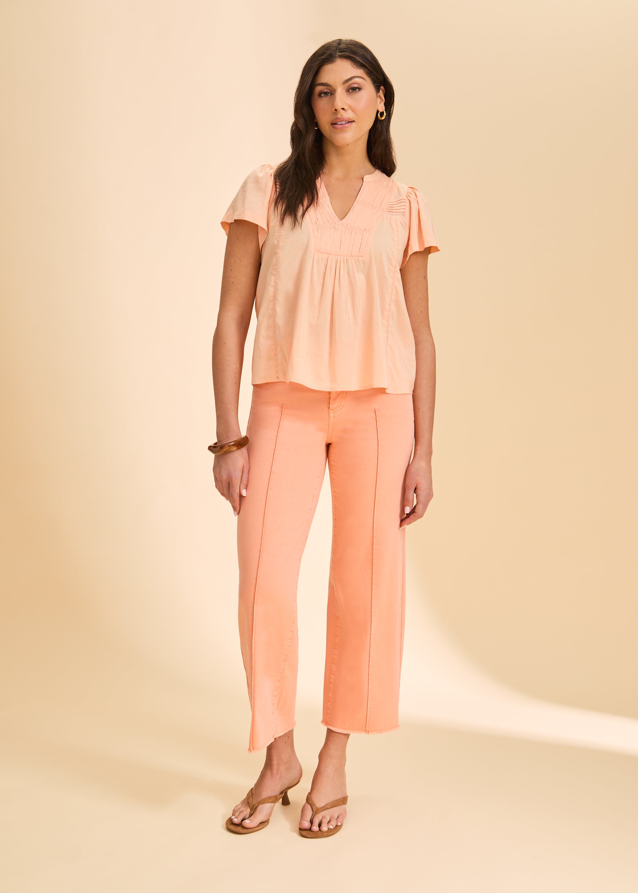 Full view of peach short-sleeve top paired with matching pants by French Dressing Jeans (FDJ)
