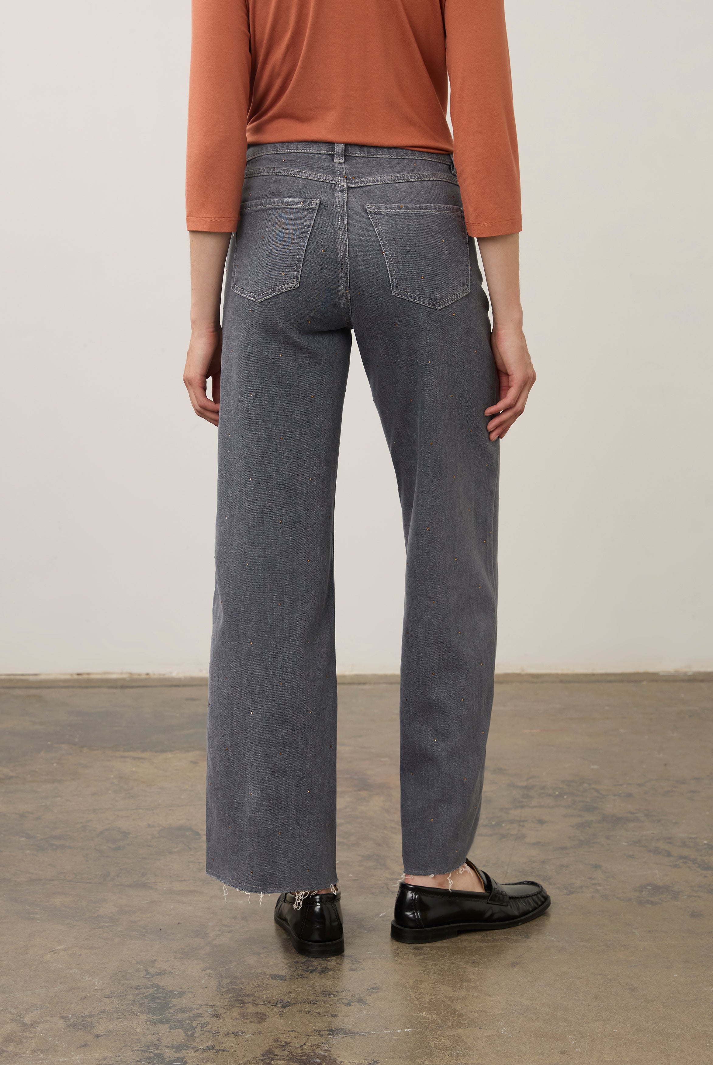 Back view of denim with raw hem and patch pockets in blue by French Dressing Jeans (FDJ) par French Dressing Jeans (FDJ)
