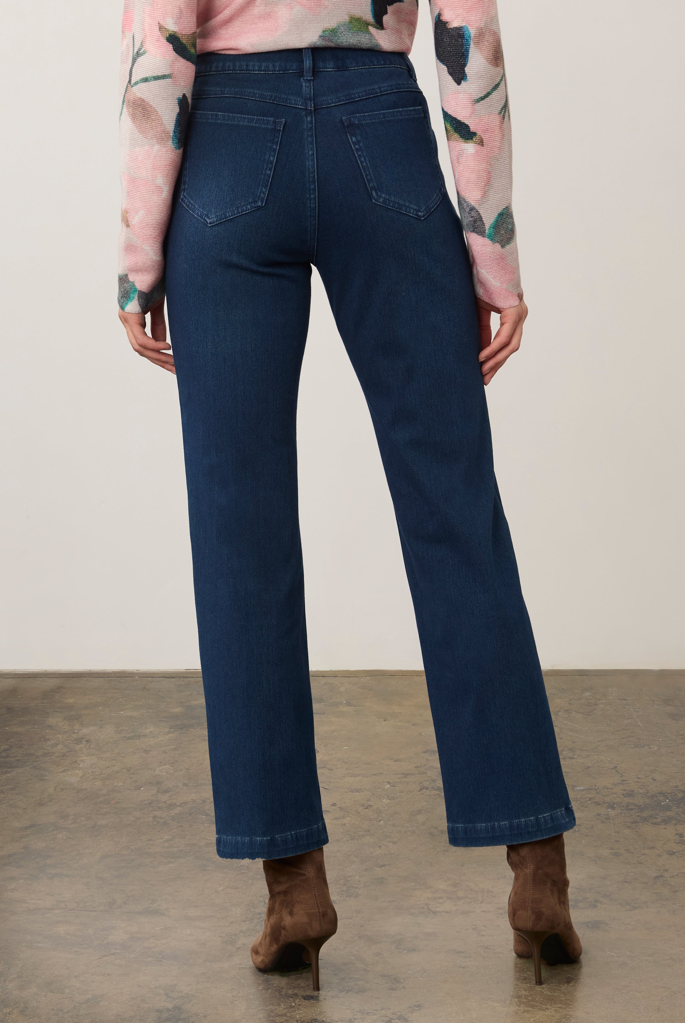 Back view of dark rinse straight-leg jeans showcasing rear pockets and seam details by French Dressing Jeans (FDJ)