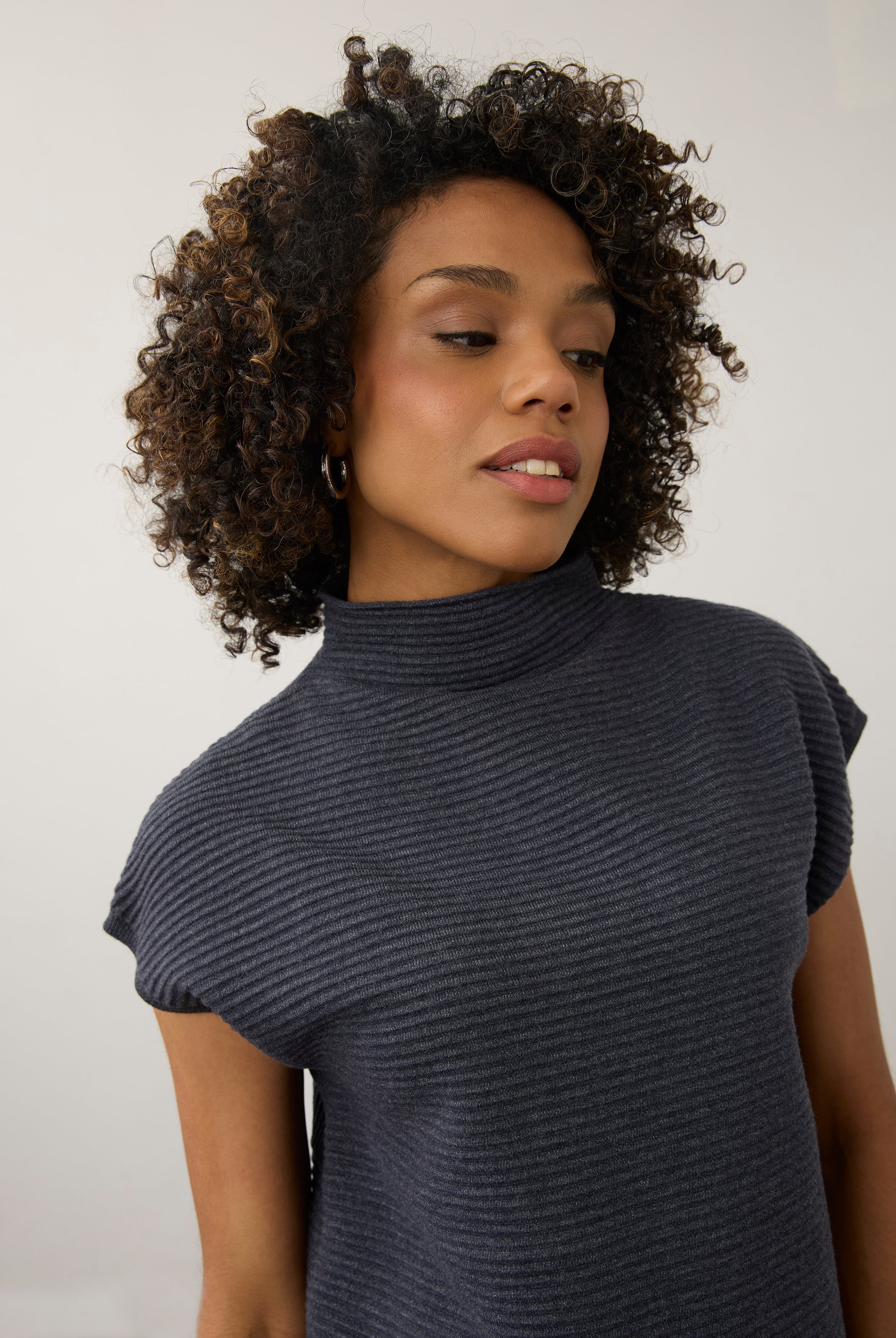 Close-up of navy ribbed top highlighting high collar and short sleeves by French Dressing Jeans (FDJ)