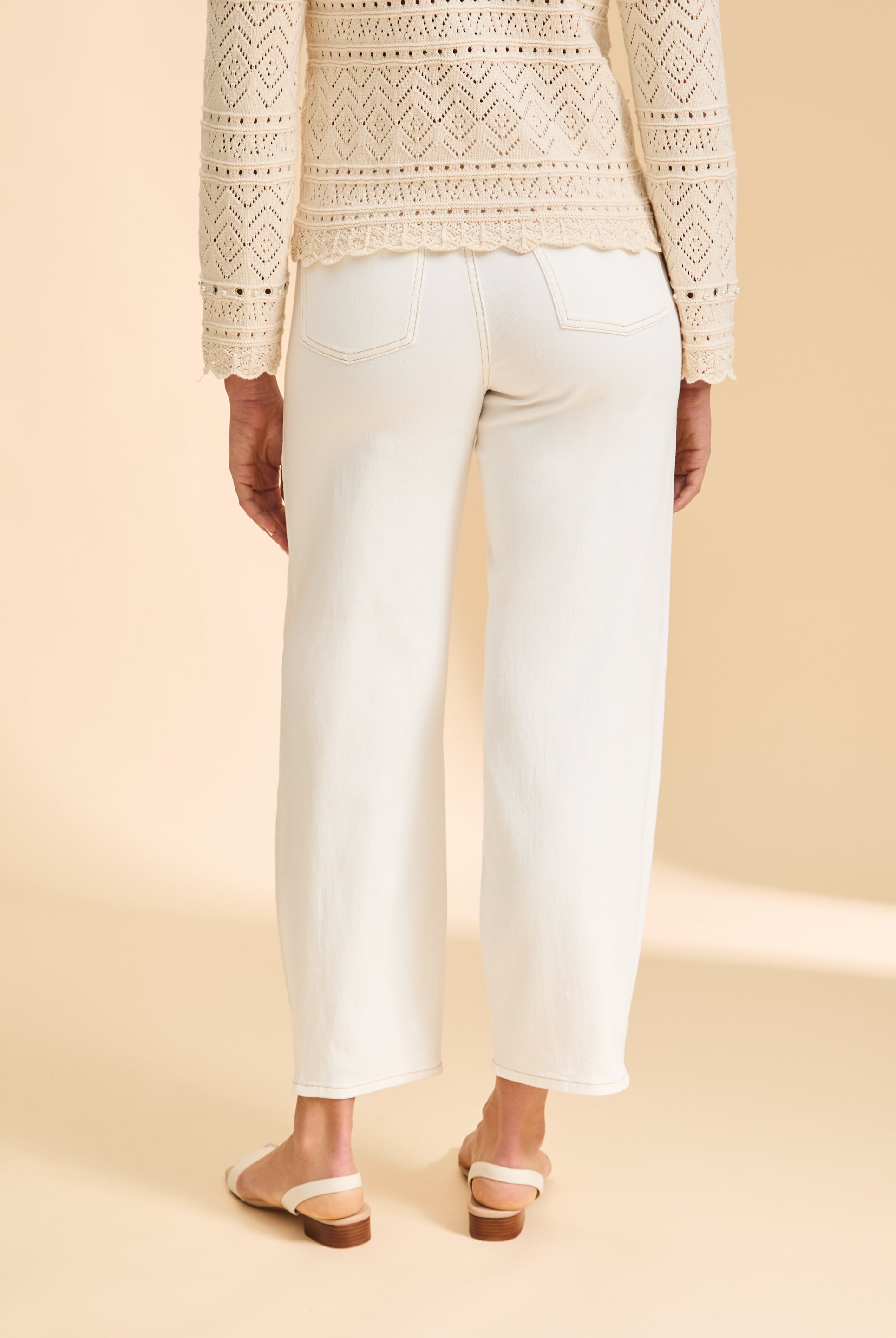 Back view of ivory Suzanne jeans with patch pockets paired with crochet top by French Dressing Jeans (FDJ)