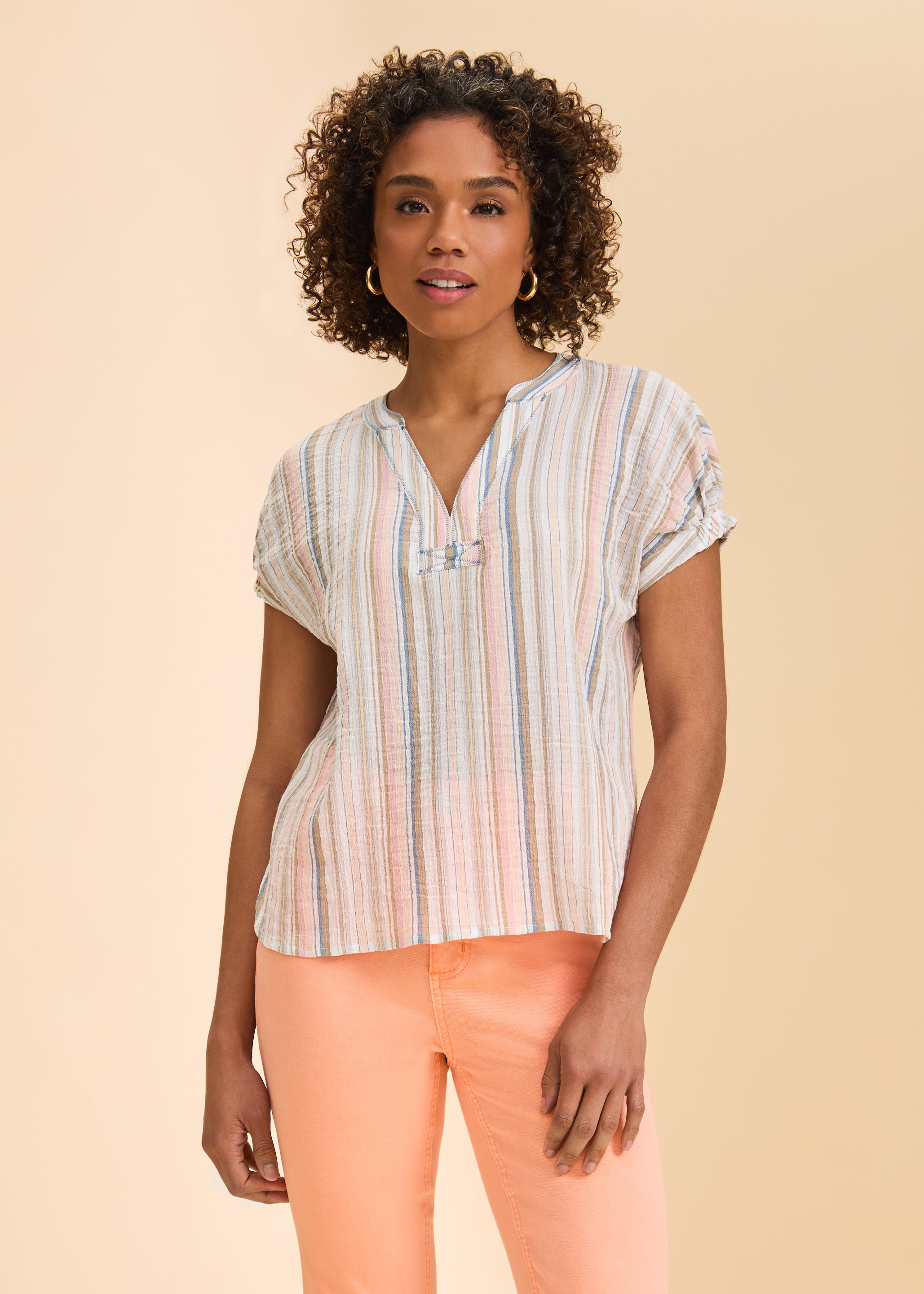 Front view of short sleeve striped blouse in pastel colors with V-neck design by French Dressing Jeans (FDJ)