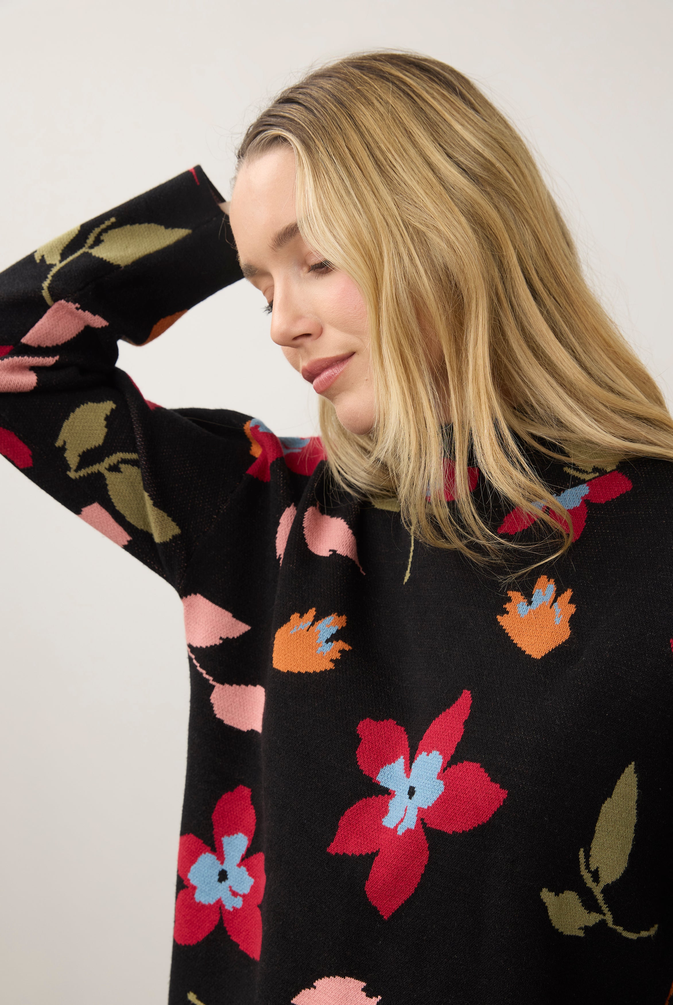 Close-up of black floral sweater with high collar detail by French Dressing Jeans (FDJ)