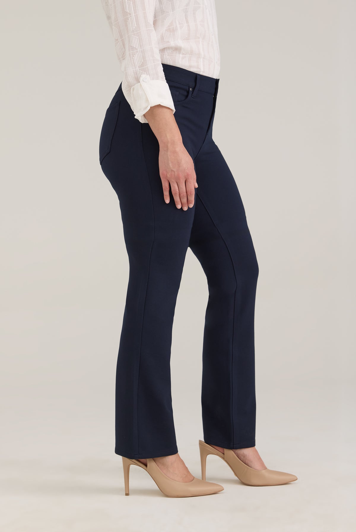 Side profile of navy pants highlighting leg silhouette and front pockets by French Dressing Jeans (FDJ)
