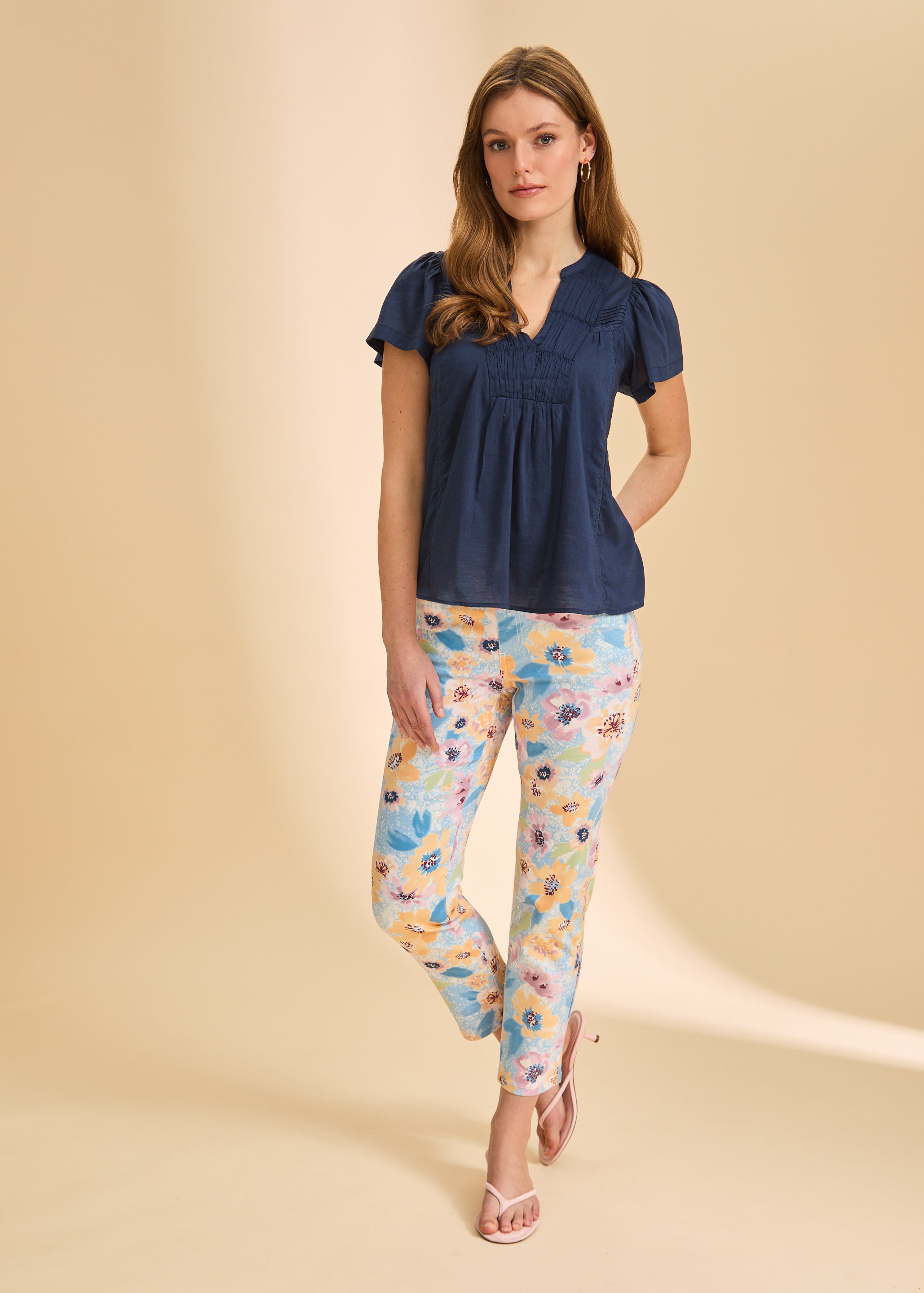 Full view of navy short-sleeve top paired with floral pants by French Dressing Jeans (FDJ)