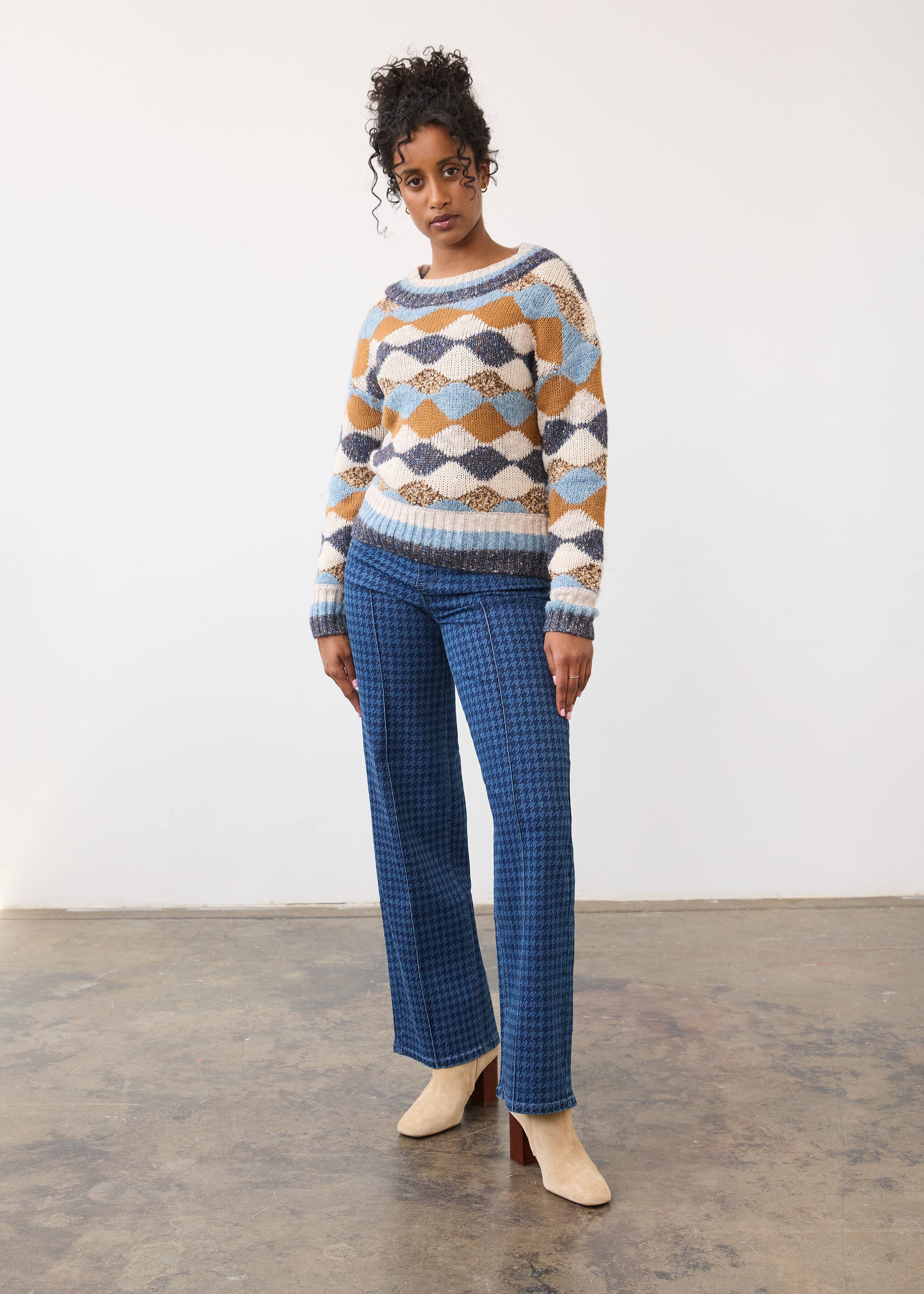 Full body view of printed sweater paired with blue pants by French Dressing Jeans (FDJ)