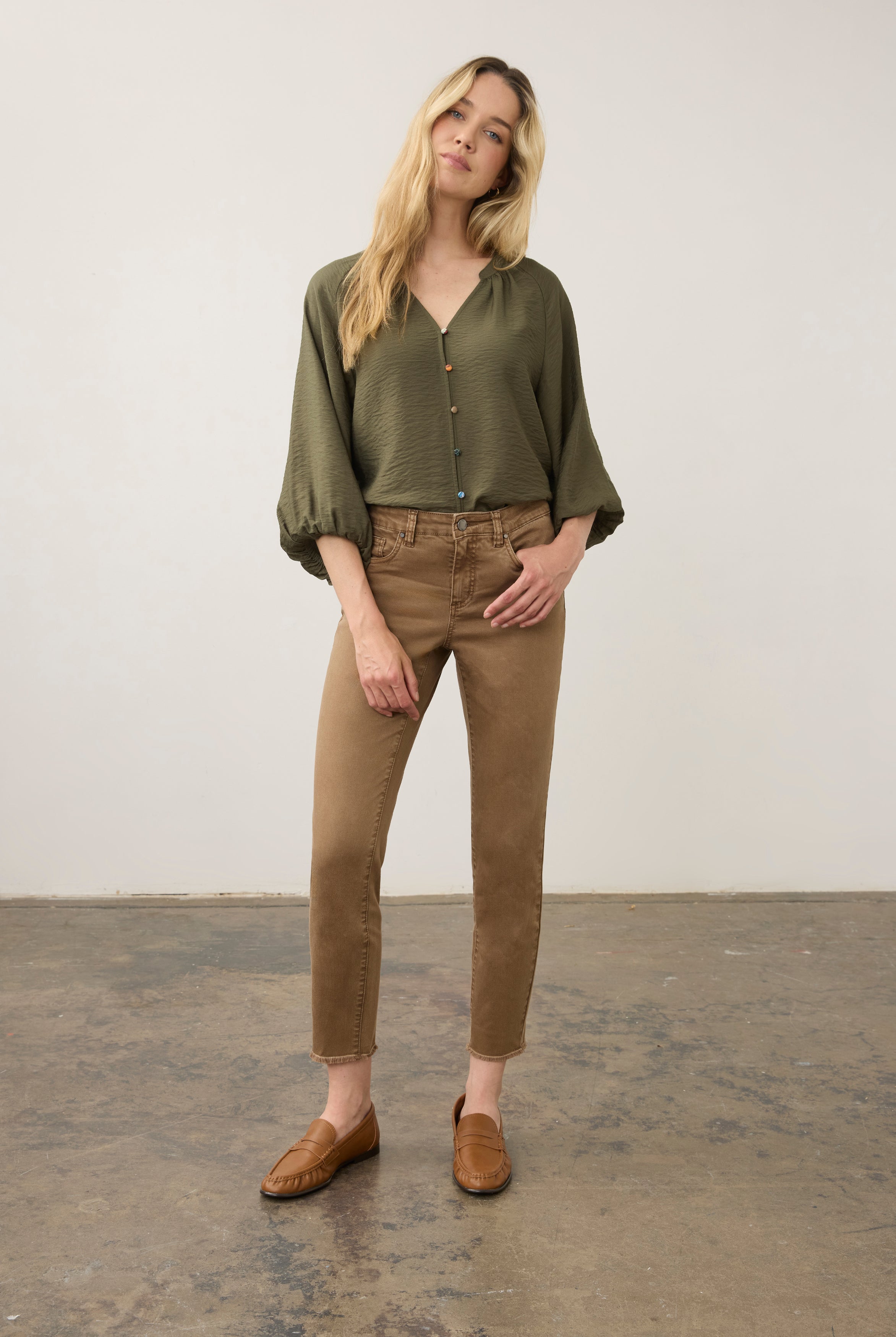 Model in olive blouse and khaki pants, full body view by French Dressing Jeans (FDJ)