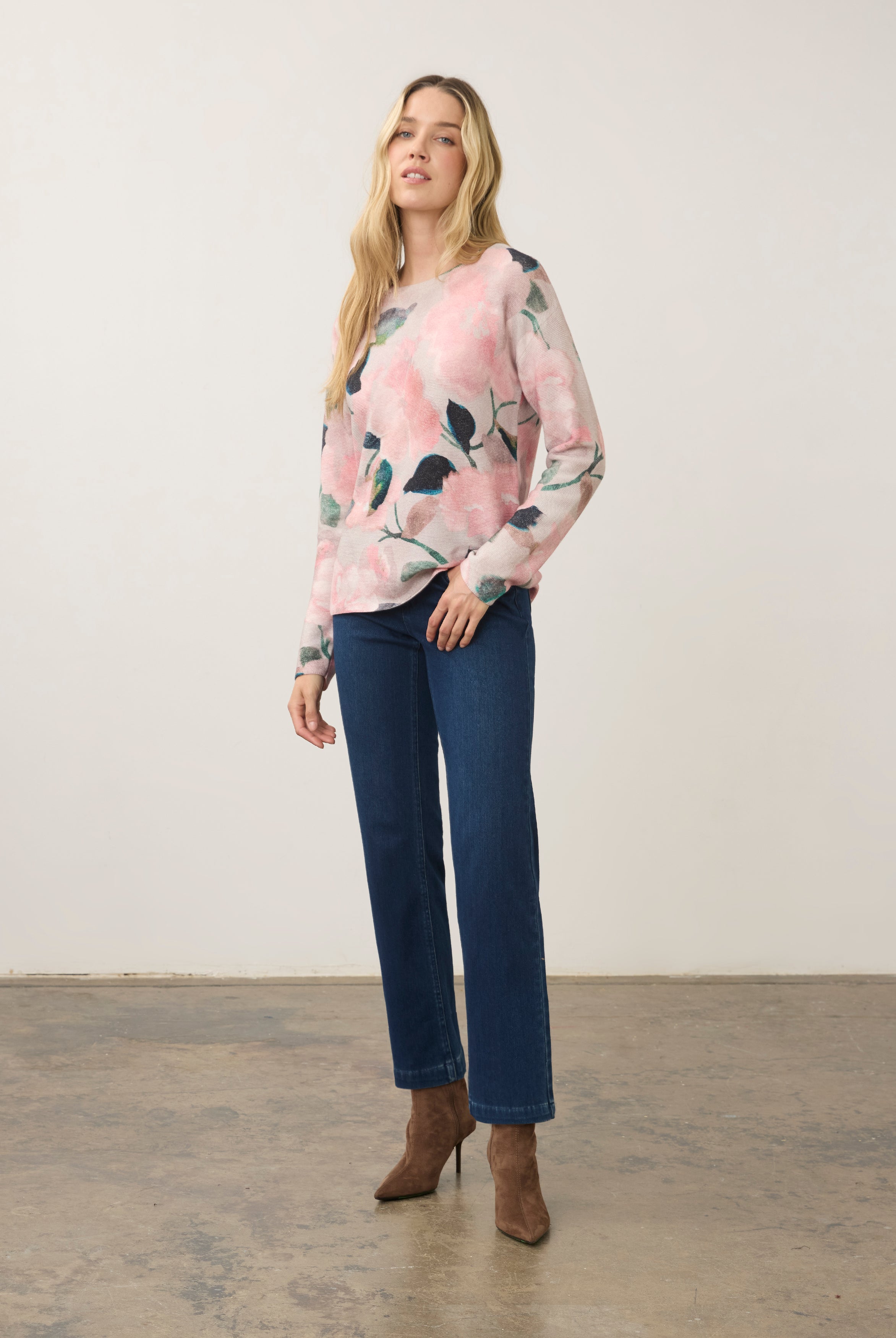 Model wearing long sleeve printed sweater in De Winter Pink paired with jeans by French Dressing Jeans (FDJ)