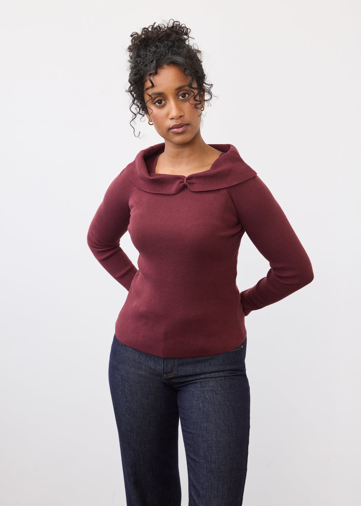 Front view of burgundy off-the-shoulder sweater with long sleeves by French Dressing Jeans (FDJ)