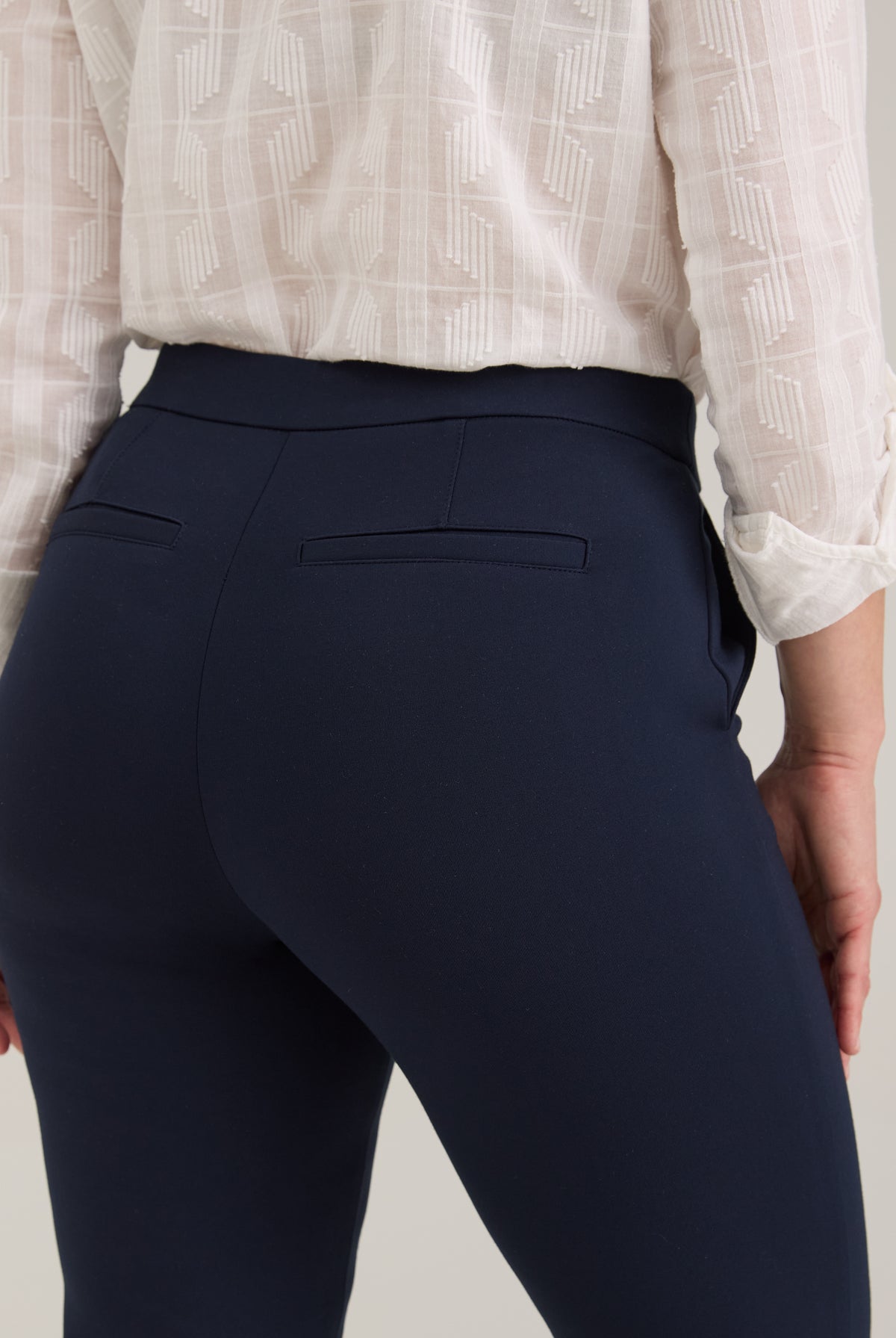 Detail shot of navy Ponte pants showing fake back welt pockets and fabric texture by French Dressing Jeans (FDJ)
