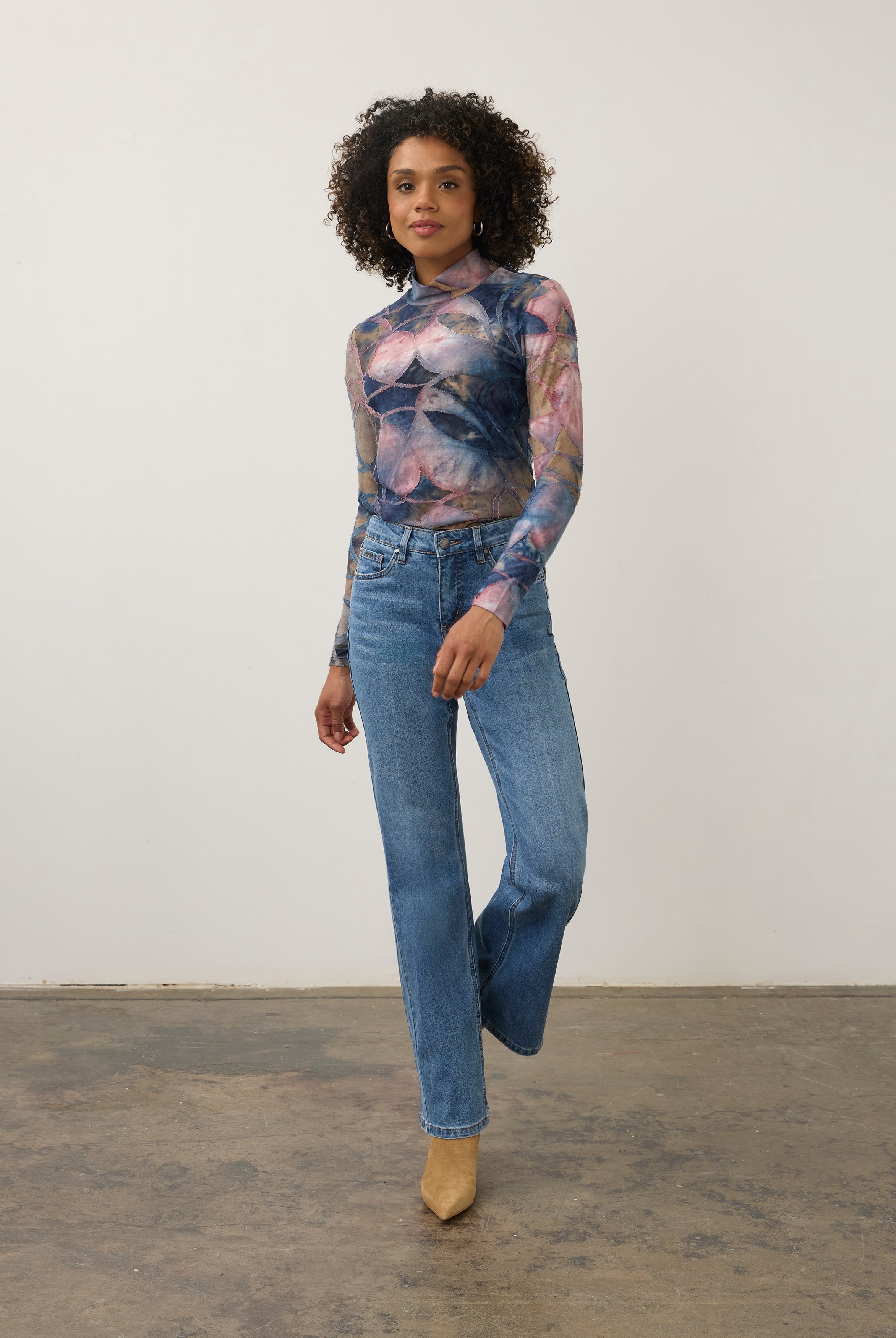 Full body view of abstract blue and pink print top with denim jeans, chic casual style by French Dressing Jeans (FDJ)