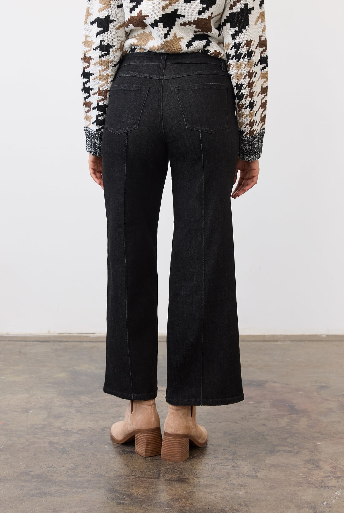 Back view of black denim featuring patch pockets and wide-leg cut by French Dressing Jeans (FDJ)