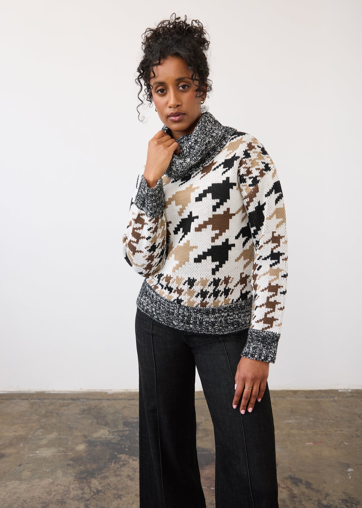 Close-up of black and beige sweater showcasing intricate pattern and cowl neck by French Dressing Jeans (FDJ)
