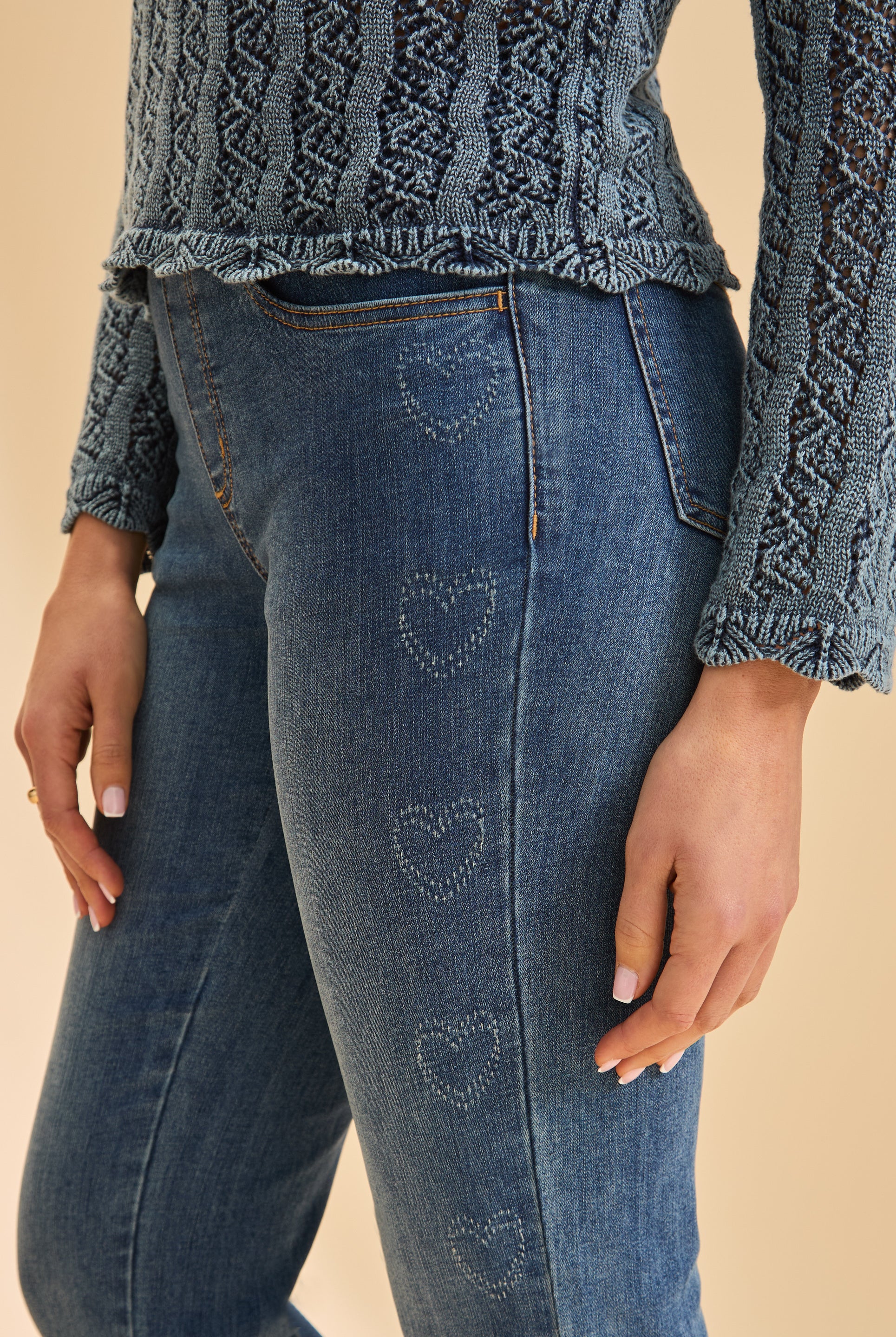 Close-up of heart pattern detail on indigo straight leg jeans by French Dressing Jeans (FDJ)