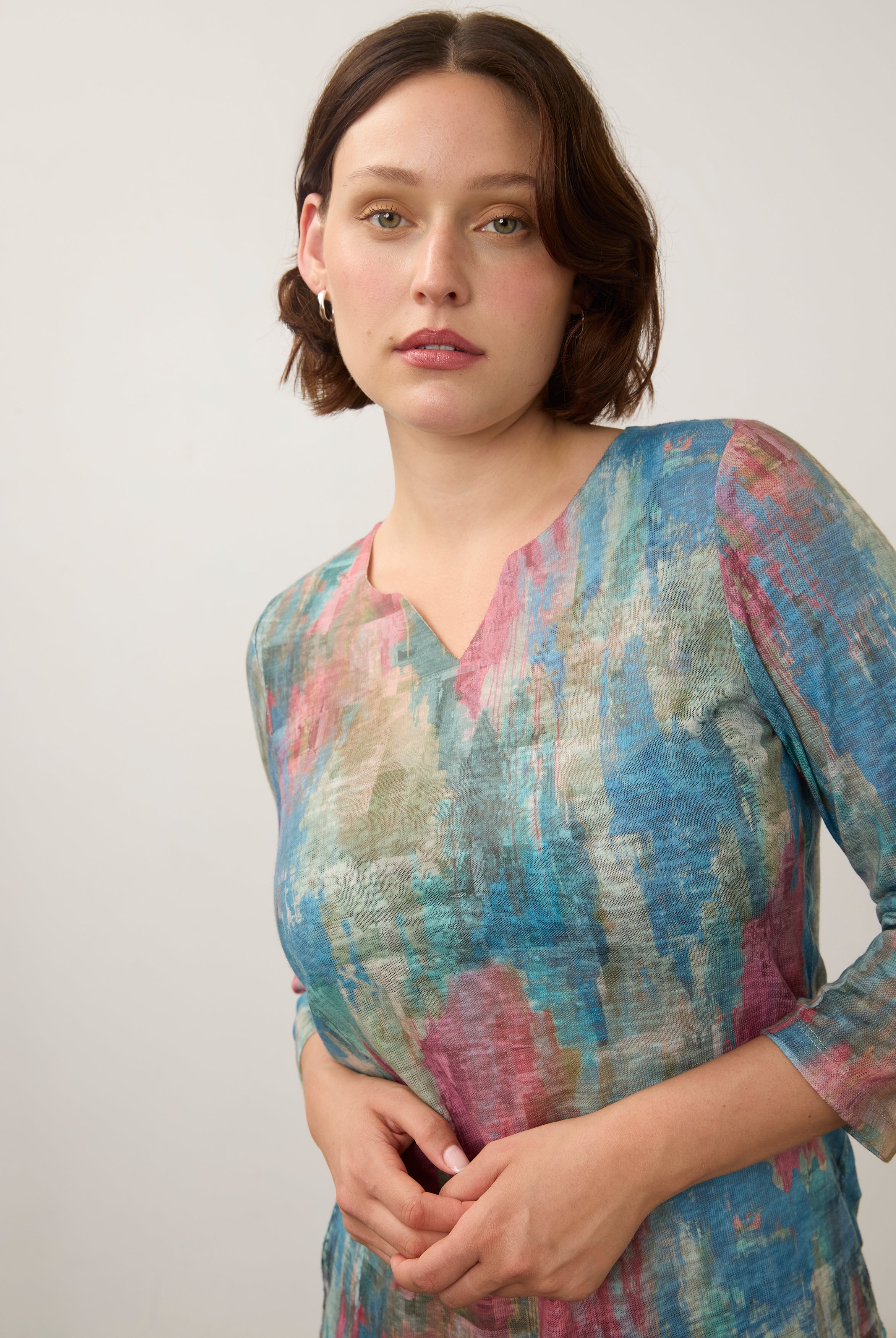 Close-up of pastel Henley top focusing on neckline and soft color blend by French Dressing Jeans (FDJ)