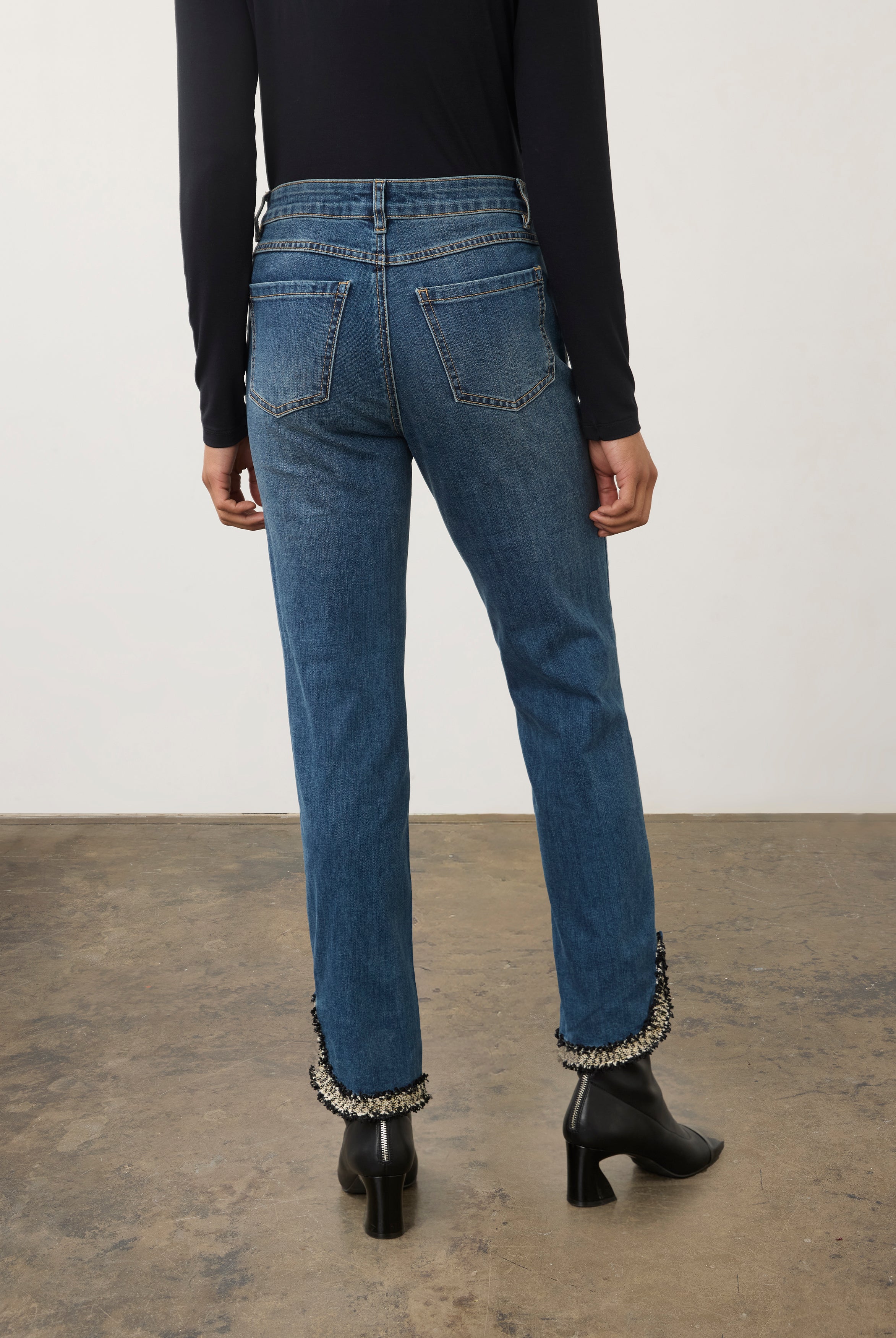 Back view of medium blue Olivia denim showing patch pockets and tapered legs by French Dressing Jeans (FDJ)