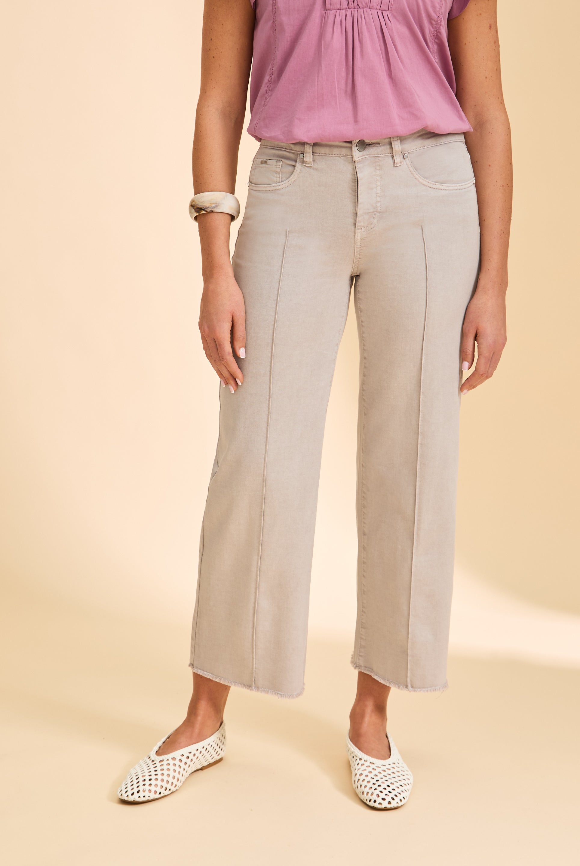 Close-up of taupe wide-leg pants with front pockets by French Dressing Jeans (FDJ)