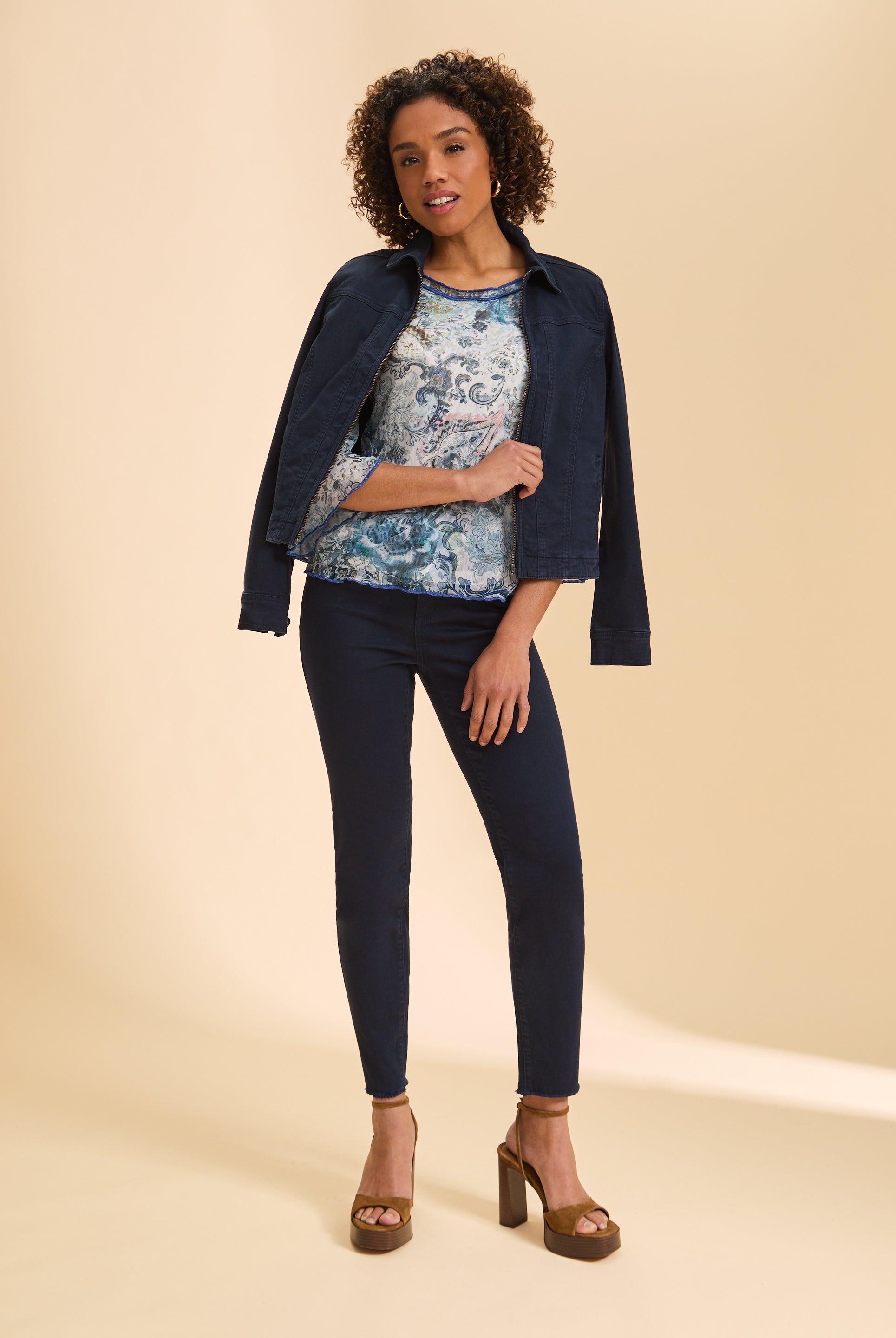 Full view of blue and white paisley top paired with denim jacket by French Dressing Jeans (FDJ)