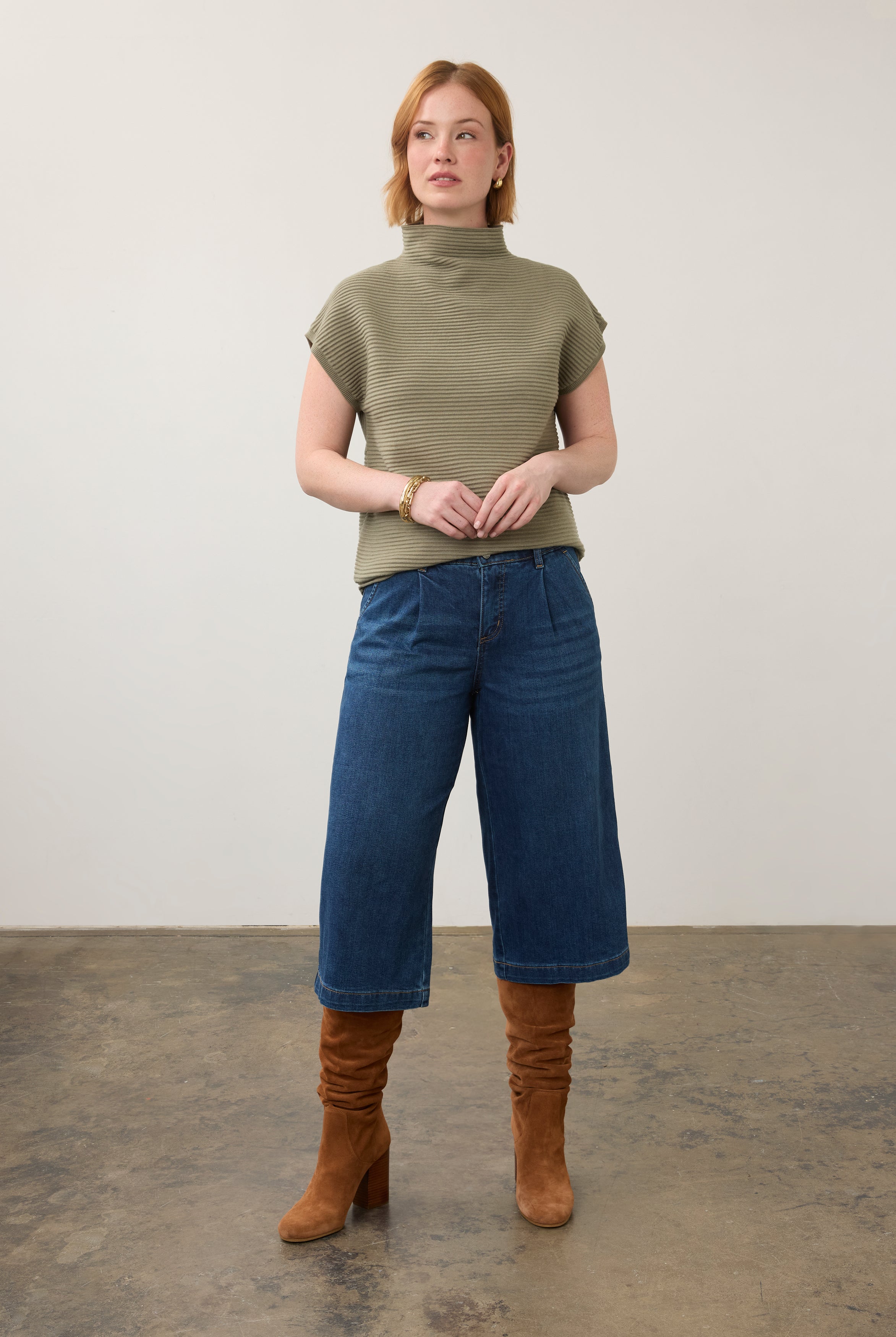 Model wearing olive green ribbed top with jeans, showcasing full outfit by French Dressing Jeans (FDJ)