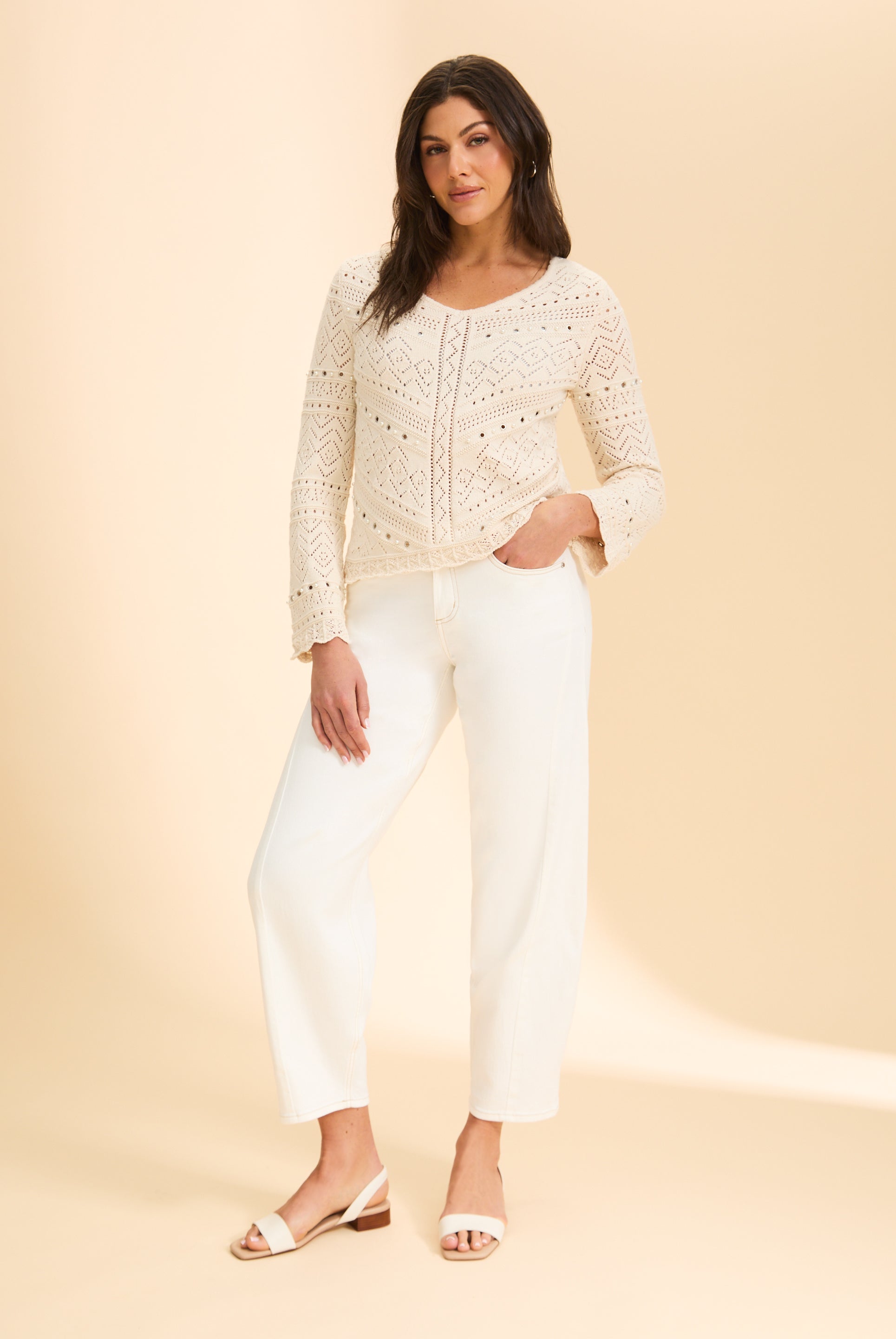 Full view of off-white crochet sweater paired with white pants by French Dressing Jeans (FDJ)