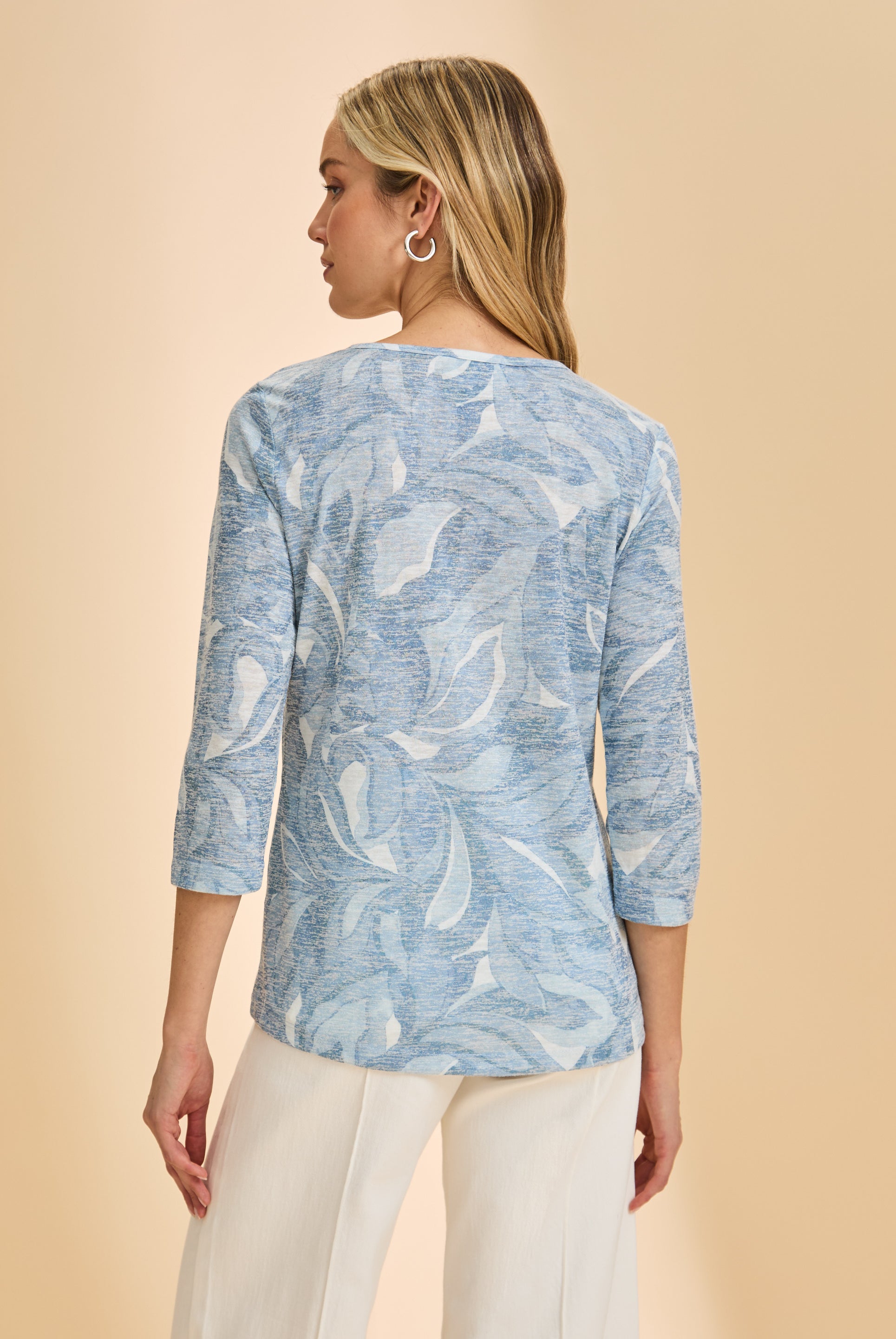 Back view of light blue floral top with 3/4 sleeves, showcasing subtle pattern by French Dressing Jeans (FDJ)