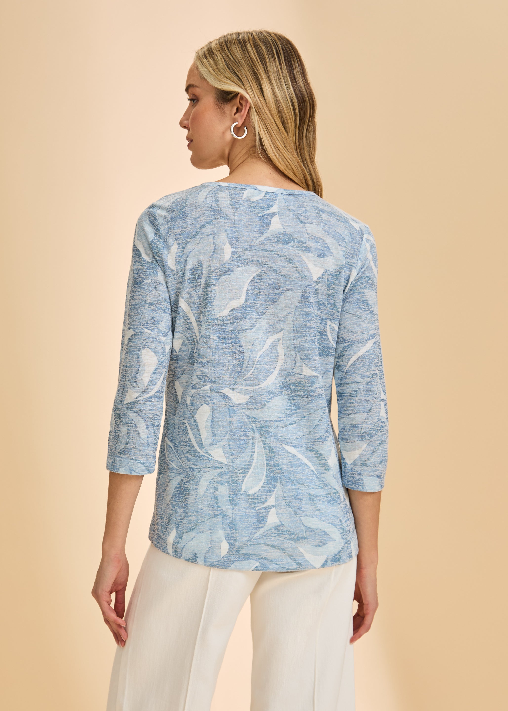 Back view of light blue floral top with 3/4 sleeves, showcasing subtle pattern by French Dressing Jeans (FDJ)