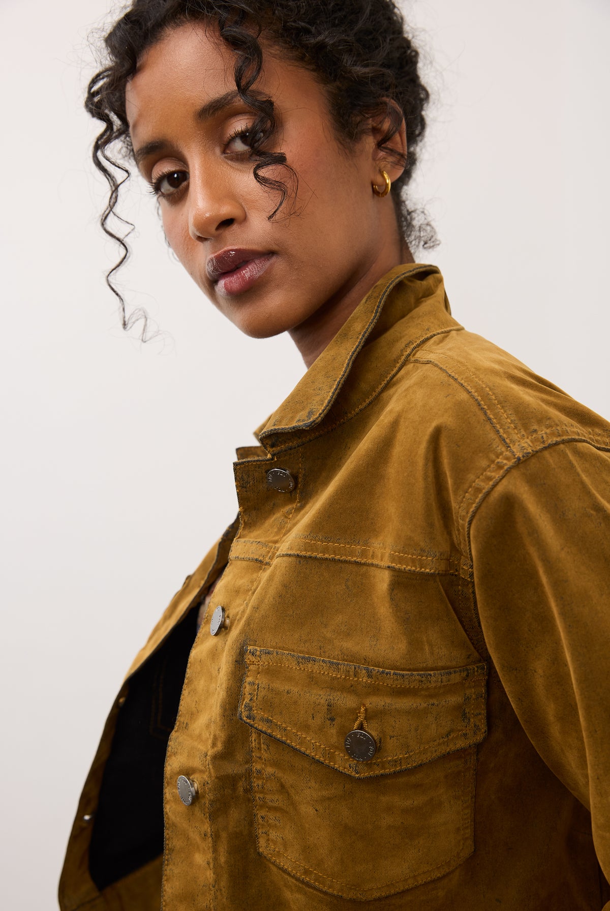 Profile view of brass Olivia jacket highlighting button details by French Dressing Jeans (FDJ)
