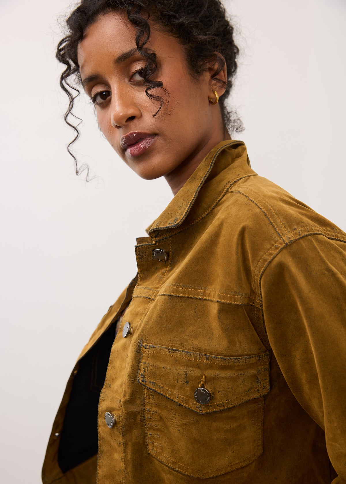 Profile view of brass Olivia jacket highlighting button details by French Dressing Jeans (FDJ)