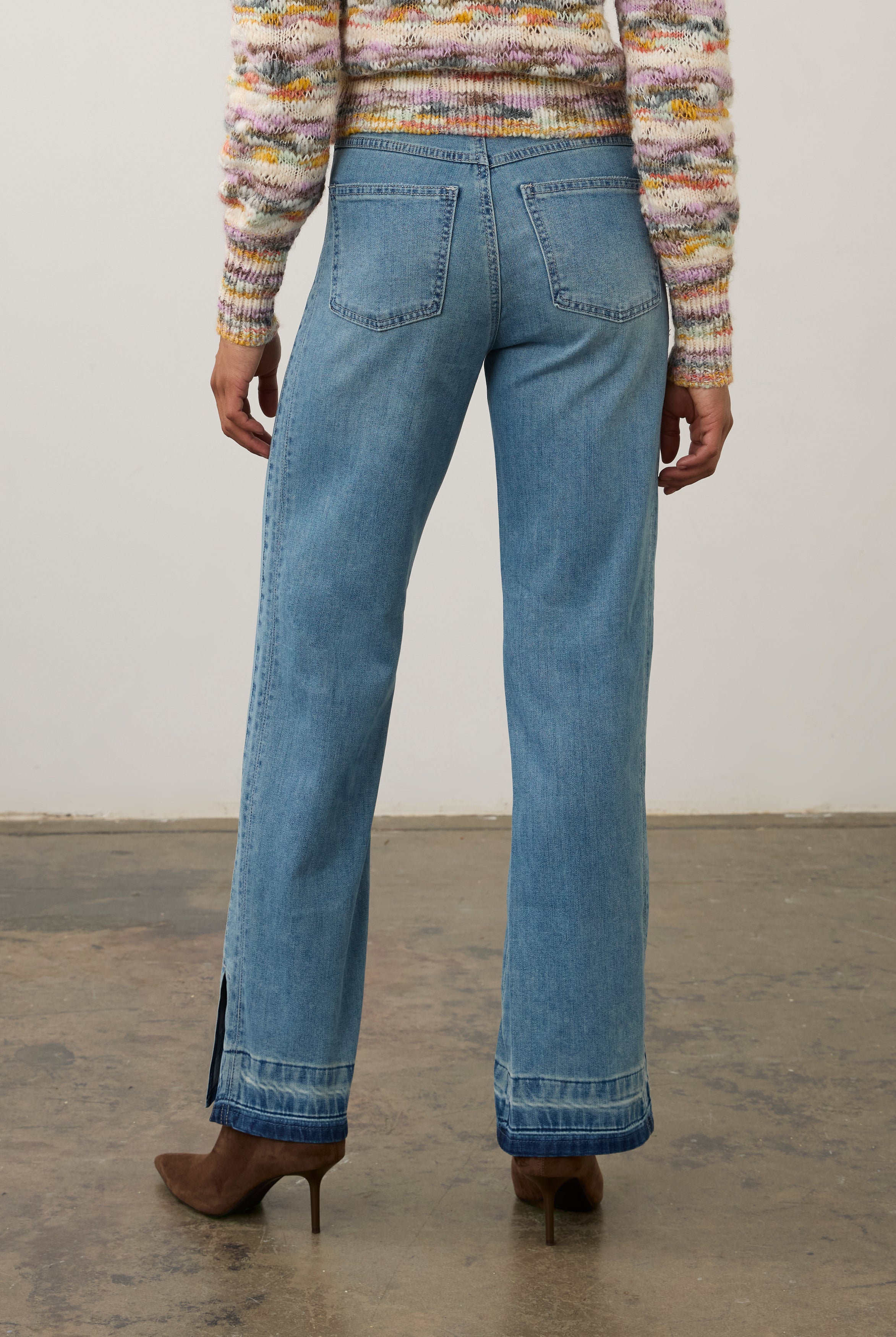 Back view of light wash denim pants featuring back patch pockets and relaxed fit by French Dressing Jeans (FDJ) par French Dressing Jeans (FDJ)