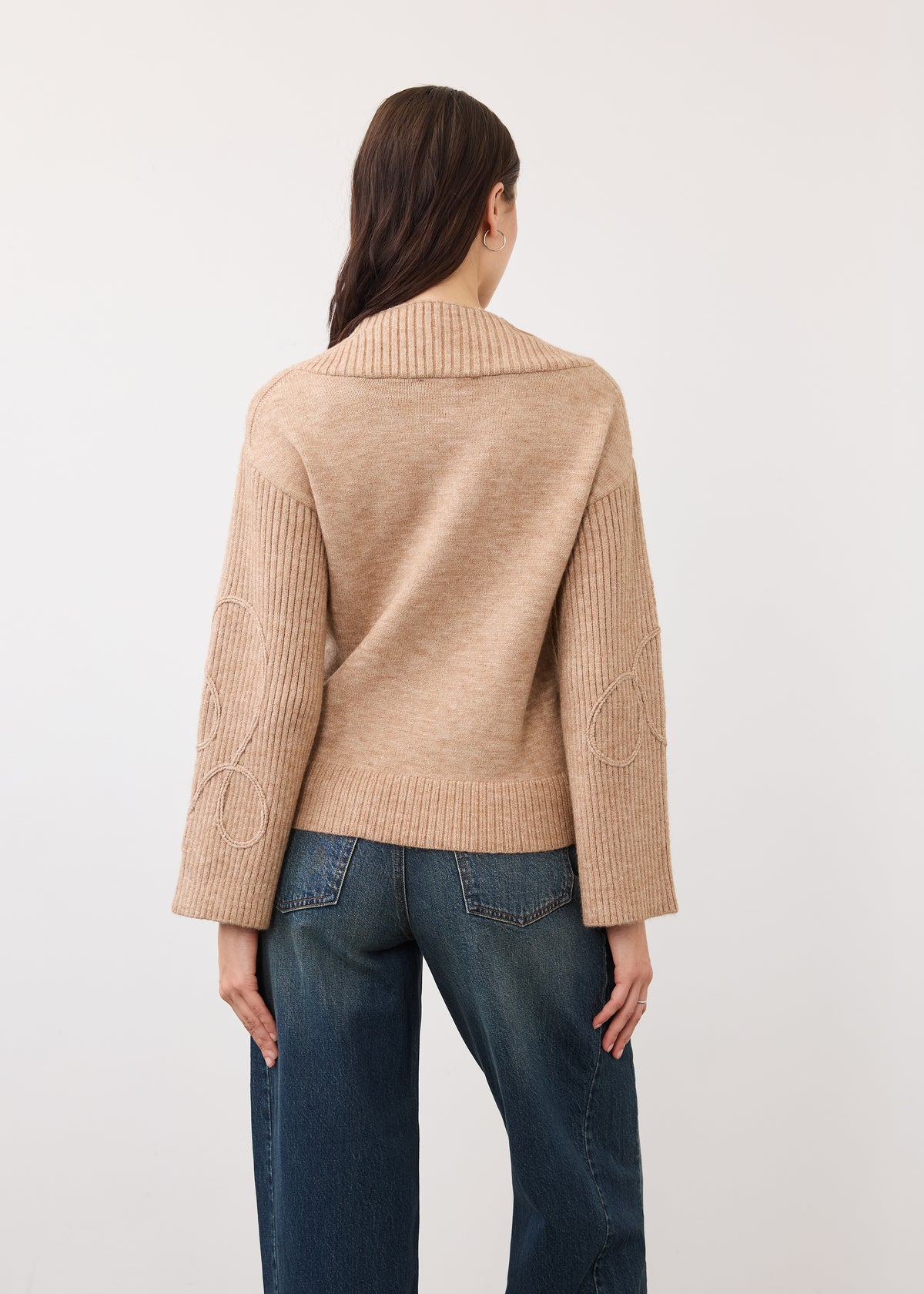 Back view of light camel sweater showing ribbed sleeves and neckline by French Dressing Jeans (FDJ)