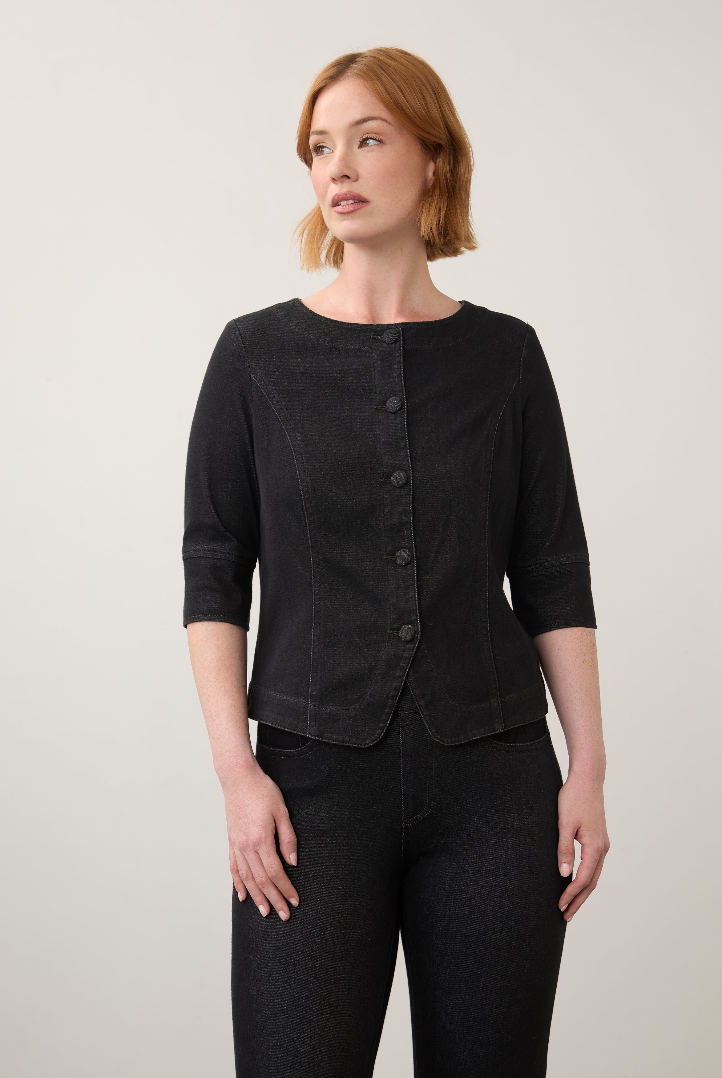 Black button-up top with elbow-length sleeves paired with dark jeans front view by French Dressing Jeans (FDJ)