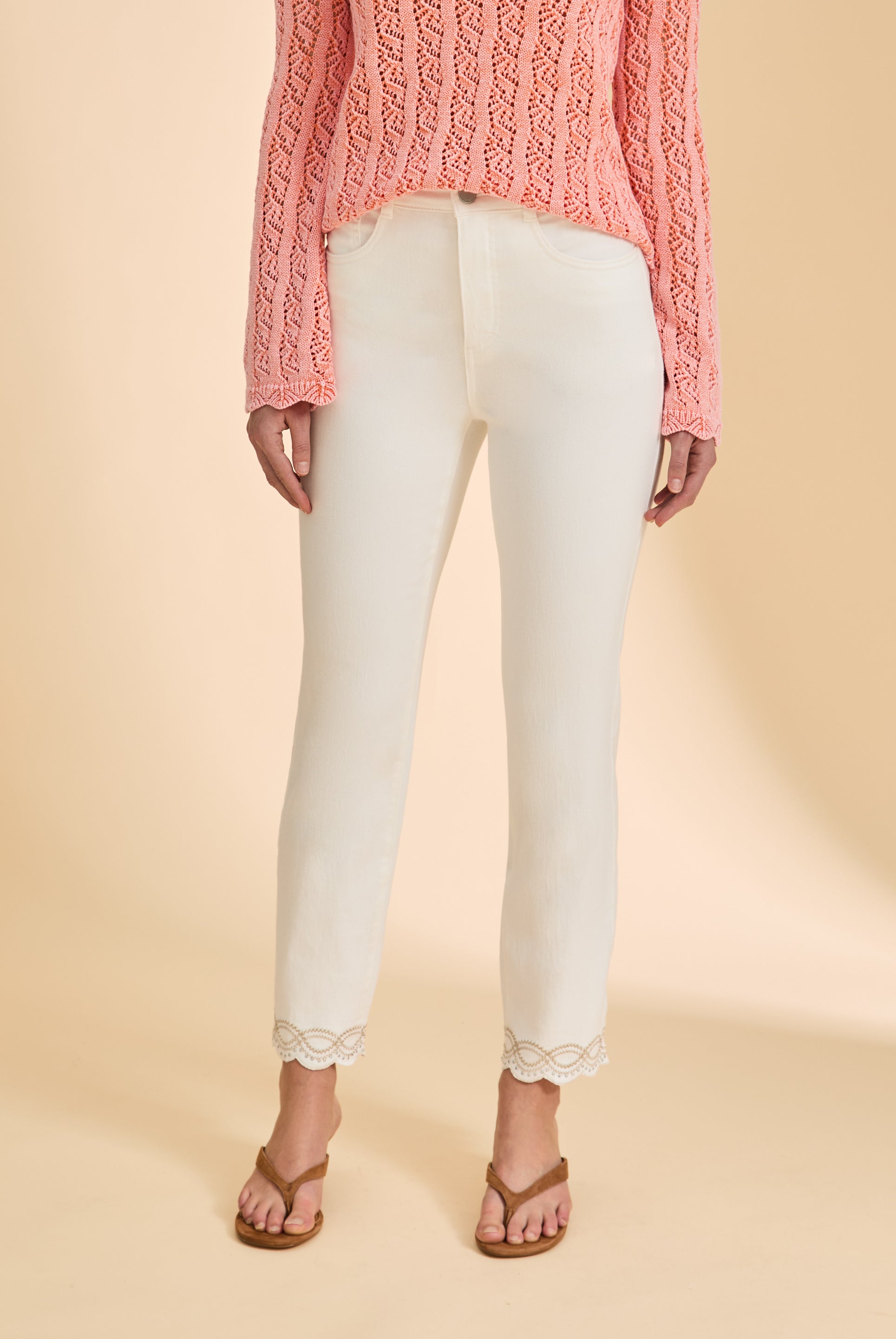 Close-up of high-rise waist and lace-trimmed ankles on ivory Suzanne denim by French Dressing Jeans (FDJ)